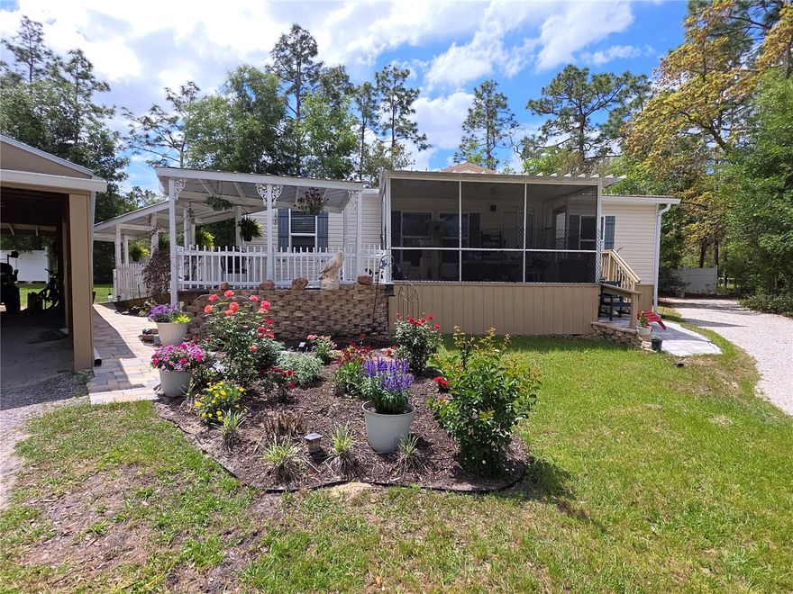 3 Bedroom Home On 1.21 Acres Of Land- Plenty Of Room For A Horse- Plus There Are Horse Trails In The Neighborhood Plus A Paved Bike Trail And The National Forest- Enter The Home from The Front Screened Porch To The Living Room And Eat In Kitchen- Split Bedroom Plan- Primary bedroom Has A Walk In Closet, Dual Sinks And A Shower Enclosure With A Bench Seat- Also A Rear Screened Porch- Inside laundry Room- Paneled Doors- Ceiling fans- Newer Metal Roof- Large Carport area or store a boat. Open Floor Plan Call Today For A Showing.