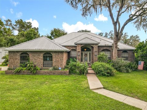 Photo of 520 Forest Creek Run, De Leon Springs, FL 32130 (MLS # V4945239)