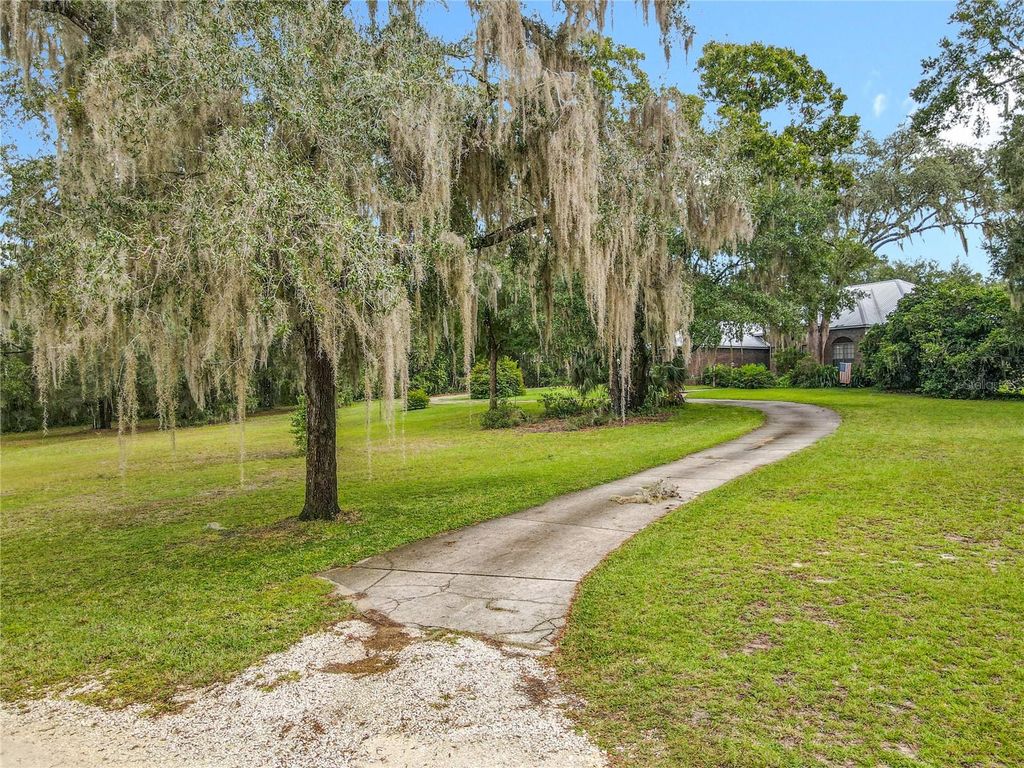 Photo of 520 Forest Creek Run, De Leon Springs, FL 32130 (MLS # V4945239)
