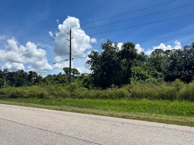 Residential Homesite with public water and NO HOA Fees! Centrally located in NW Port Charlotte, just minutes from Tamiami Trail, fast growing North Port, Port Charlotte business district, and Charlotte County's Centennial Park with athletic fields, indoor sports arenas, and public pool heated to 85F year round! BUILD YOUR DREAM HOME, we can help you find the perfect builder to make your new Florida home exactly the way you want it! Bring your toys, Boats and RVs welcome, Room For Pool!! Watch the sunrise from your future Lanai, where beautiful oaks beautify this little corner of the block. And enjoy sunsets from your front porch...it's all a possibility! Adjacent lot also available see MLS D6142663 for more info!