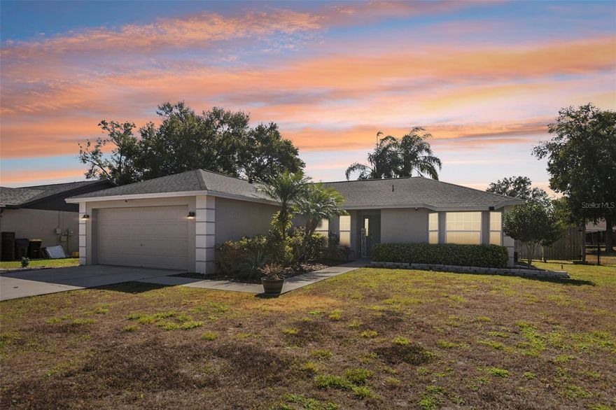 One or more photo(s) has been virtually staged. This sweet south Lakeland home is a total find! New Roof in 2020! Freshly painted interior walls, doors, and trim! It’s a solid concrete block, single-level home that feels easy and welcoming the moment you walk in. You’ll love how the layout is set up with the bedrooms split apart for a bit of extra breathing room. The main living spaces and primary suite feature beautiful NEW Lifeproof LVP flooring installed, which is a breeze to keep tidy, while the guest bedrooms have that cozy carpet feel underfoot. The kitchen is huge, with plenty of space for a table plus a breakfast bar that’s just right for morning coffee or a quick bite. Having the laundry inside is such a nice perk, too. When you head out back, there’s a great screened porch for relaxing without the bugs, and it's calling for your next weekend barbecue. The yard is fully fenced and sits on nearly a quarter-acre, giving you plenty of space to enjoy the Florida sunshine or maybe an evening by a fire pit. It’s a genuinely lovely place that’s ready for you to move right in and make it your own.