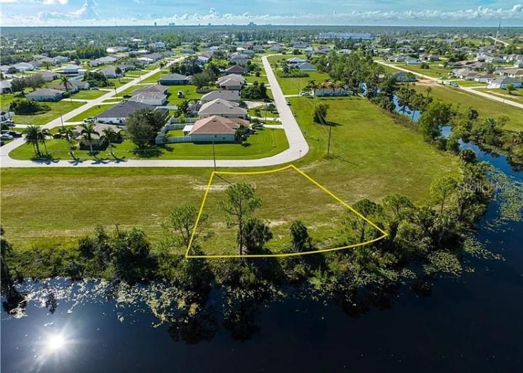 Photo of 2117 NE 43rd Lane, Cape Coral, FL 33909 (MLS # TB8484234)