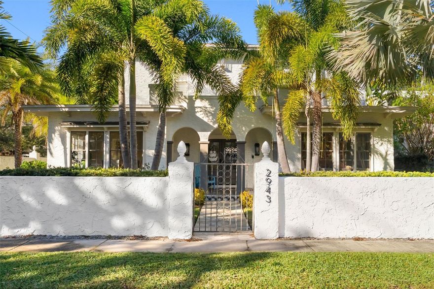 Step into timeless elegance with this beautifully reimagined 1920s estate, perfectly situated just steps from iconic Bayshore Boulevard in South Tampa. This captivating 4-bedroom, 4.5-bath home blends historic charm with modern luxury at every turn. A grand wrought iron gate welcomes you to the property, leading up Spanish-tiled steps and onto a charming front porch. Inside, the home opens to a stunning living room featuring original oak hardwood floors, abundant natural light, a wood-burning fireplace, and elegant French doors that lead to a balcony. An extended, light-filled space with custom built-ins offers the perfect setting for a home office or reading retreat. The formal dining room is equally impressive, framed by large picturesque windows that create an ideal atmosphere for entertaining. A connecting hallway lined with generous storage and a stylish half bath leads to the heart of the home—a chef’s dream kitchen. Outfitted with a 6-burner Viking gas range, Bosch stainless steel appliances, custom wood cabinetry, and expansive quartz countertops, the space is both functional and beautiful. A large island and views of the courtyard complete the design. Flowing seamlessly from the kitchen, the spacious family room extends to the rear of the home, offering the perfect layout for gatherings or relaxed everyday living. Outside, a tranquil courtyard awaits, featuring a Spanish-tiled fountain, travertine pavers, ambient lighting, a privacy wall, a new pergola, and surround sound—an ideal private oasis. Beyond the courtyard, you’ll find a two-car garage and a fully remodeled casita. This stylish guest retreat includes a wet bar, wine fridge, beverage center, full bath, custom shelving, and its own AC—perfect for hosting in comfort and style. Upstairs, the primary suite offers a serene escape with a spa-inspired ensuite bath complete with dual vanities, a spacious walk-in shower, a classic clawfoot tub, and a heated towel rack. A second bedroom features its own ensuite bath with distinctive tilework, while the third bedroom showcases French doors and easy access to a beautifully updated hall bath. Additional highlights include fresh interior and exterior paint, a whole-home Control4 surround sound system, lush landscaping with accent lighting, an indoor laundry room, and a fully enclosed privacy wall. Located on a picturesque tree-lined street, this exceptional home is just minutes from top dining, shopping, Tampa Yacht & Country Club, Ballast Point Park, MacDill Air Force Base, downtown Tampa, major bridges, and Tampa International Airport. A rare opportunity to own a piece of history—meticulously updated for modern living.