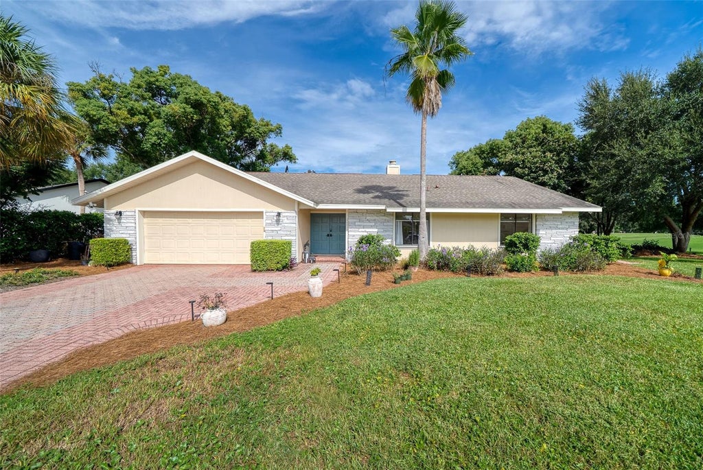 Photo of 7601 Orange Tree Lane, Orlando, FL 32819 (MLS # O6446340)