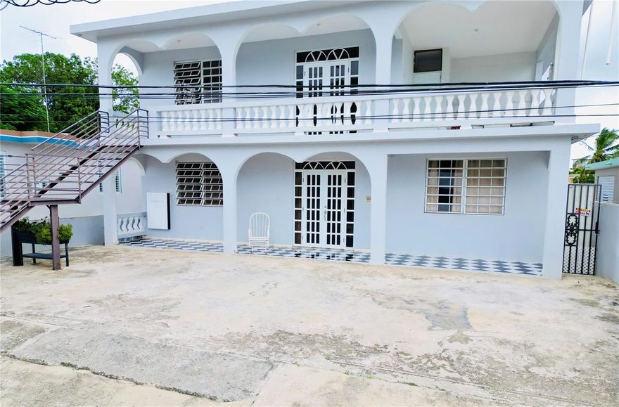 One or more photo(s) has been virtually staged. This excellent multifamily property, located just steps from some of the best beaches in Puerto Rico and close to supermarkets, restaurants, and other conveniences, offers the perfect combination of quality living and income-producing potential. The residence features two independent units: the first floor includes 3 bedrooms, 1 bathroom, a living room, dining area, kitchen, and a well-ventilated balcony, while the second floor offers 3 bedrooms, 1 bathroom, a cozy balcony, and a laundry area. The property also includes a solar energy system that provides greater efficiency and reduced operational costs, making it an ideal option for a primary residence or for short- or long-term rental investment.