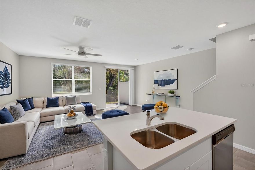 One or more photo(s) has been virtually staged. Live just minutes from Nokomis Beach and enjoy the ease of low-maintenance Florida living in this nearly new townhome located in the boutique community of Spencer Cove.

Built in 2023, this 3-bedroom, 2.5-bath home offers 1,539 square feet of thoughtfully designed living space with a bright, open-concept layout ideal for both everyday living and entertaining. The first floor features a light-filled living and dining area seamlessly connected to the kitchen, complete with quartz countertops, white shaker cabinetry, stainless steel appliances, and a central island.

Sliding glass doors lead to a private rear patio with no direct rear neighbors, offering a peaceful, natural backdrop rarely found in townhome living.

Upstairs, a versatile loft provides flexible space for a home office, second living area, or playroom. The spacious primary suite features excellent natural light, a walk-in closet, and an en-suite bath, while two additional bedrooms and a full bath provide room for guests or family. A dedicated laundry room adds everyday convenience.

Additional highlights include an attached garage, driveway parking, and modern construction for energy efficiency and long-term peace of mind. Designed for simplicity and comfort, this home offers a true move-in ready, low-maintenance lifestyle.

Spencer Cove is a quiet, well-maintained community of just 72 homes with low HOA fees of $218/month, covering exterior maintenance and grounds care. The community is pet-friendly and allows flexible rental options up to 12 times per year, making it an excellent option for both homeowners and investors.

Conveniently located near Nokomis Beach, Downtown Venice, Legacy Trail, Sarasota Memorial Hospital, and a variety of shopping and dining options, this home offers the perfect balance of location, lifestyle, and value.

Priced competitively in today’s market, this is a standout opportunity for a primary residence, seasonal retreat, or investment property.
Schedule your private showing today.