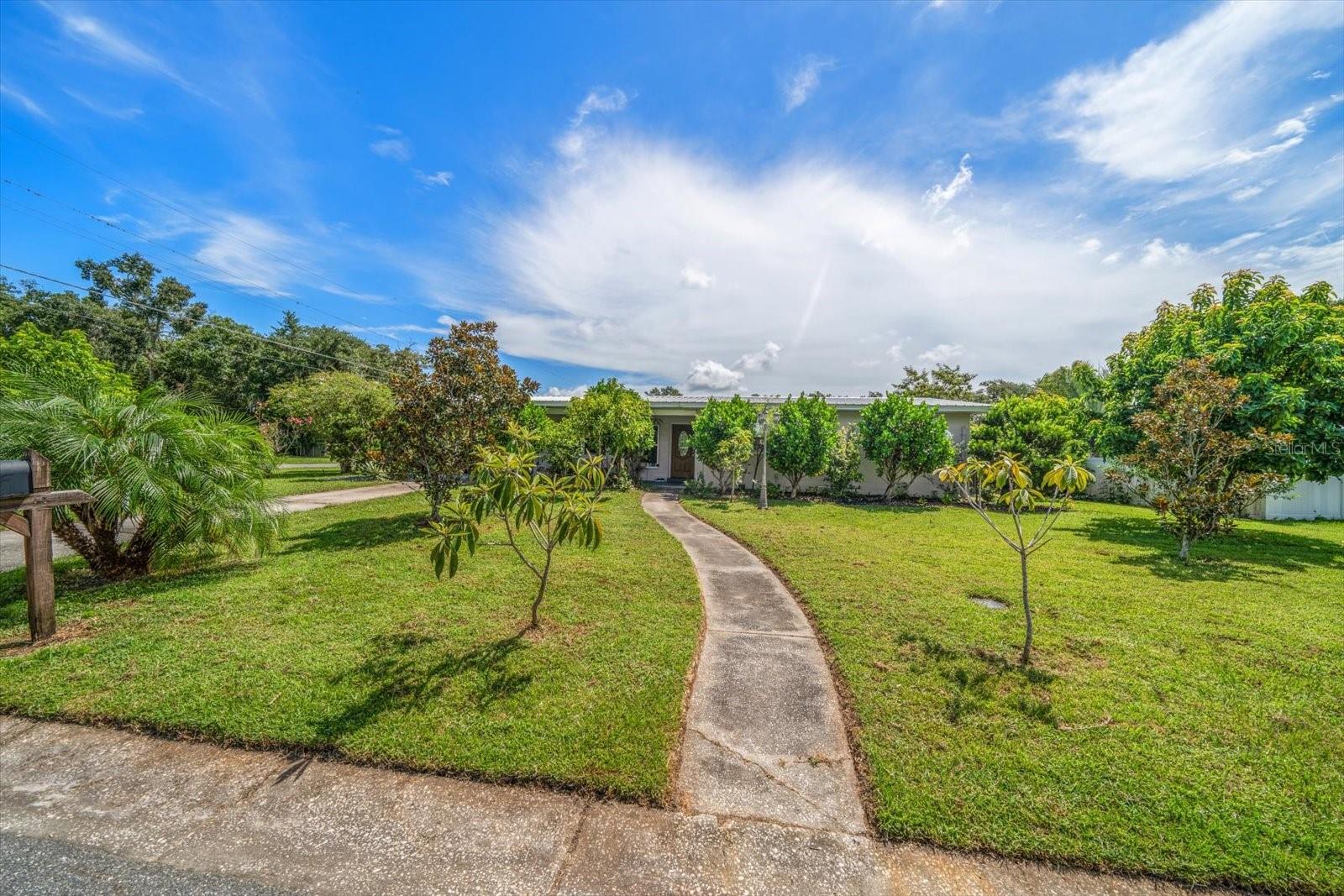 Welcome to 1404 N Palm Drive! This fully renovated 3-bedrooms, 2 bath home offers 1,923 sq ft heated of modern living in Plant City. Built in 1959 and thoughtfully updated, it features new water and sewer lines, granite countertops in kitchen and bathrooms(real subway marble tiles), and a complete set of Kitchen Aid appliances plus new washer & dryer. Comfort is assured with a new 16-SEER Trane A/C system and new ductwork, while luxury finishes include Luxury Vinyl flooring in the family room, Spanish style tile throughout, marble bathrooms, recessed lighting in the dining room, crown molding and a rustic fireplace with real stone a stunning focal point. All windows have been replaced and the home has a Lifetime Metal Roof for lasting protection and value. Outdoor living is enhanced with wood 6x6 posts added to patio areas in 2025, mature fruit trees (including avocado and loquats), and a brand new Patiowell 8x12 resin storage shed with windows, floor and lockable door--ideal for patio furniture, bicycles or lawn mowing gear. This move-in ready home combines timeless charm with modern upgrades, offering the best of Florida living.