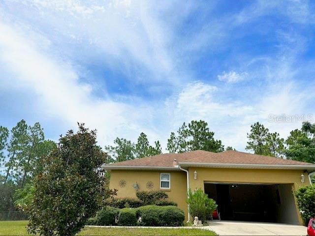 Discover this beautiful 3-bedroom, 2-bathroom home on a private 1-acre lot in the quiet Rainbow Lake Estates community, with NO HOA and 2,552 total square feet of comfort and charm.
A concrete driveway leads to a spacious two-car garage, perfect for storage or a workshop. The inviting screened front porch with curtains welcomes you inside, where a foyer opens to a cozy living room and a dining area ideal for family gatherings or entertaining guests. The kitchen offers plenty of counter space, a casual dining area, and a window view of the lush backyard, the perfect spot for your morning coffee.
Master suite includes a bedroom set and a large walk-in closet. Two additional bedrooms feature ceiling fans, and generous space. Throughout the home, ceramic tile flooring combines elegance with easy maintenance.
Step outside to a screened back patio made for year-round dining, relaxing, or entertaining. The backyard features mature orange and avocado trees, and the entire property is fully enclosed with a chain link fence for privacy and security. An oversized metal building provides RV parking, a kitchenette, and abundant utility storage for vehicles, tools, and toys. The home sits 100 feet back from the road, offering privacy, peace, and no close neighbors.
This sale includes the living and dining sets, patio set, master bedroom set, and all curtains for both the front and back porches.
Experience the perfect blend of country charm, modern comfort, and nature’s bounty — come see it today!