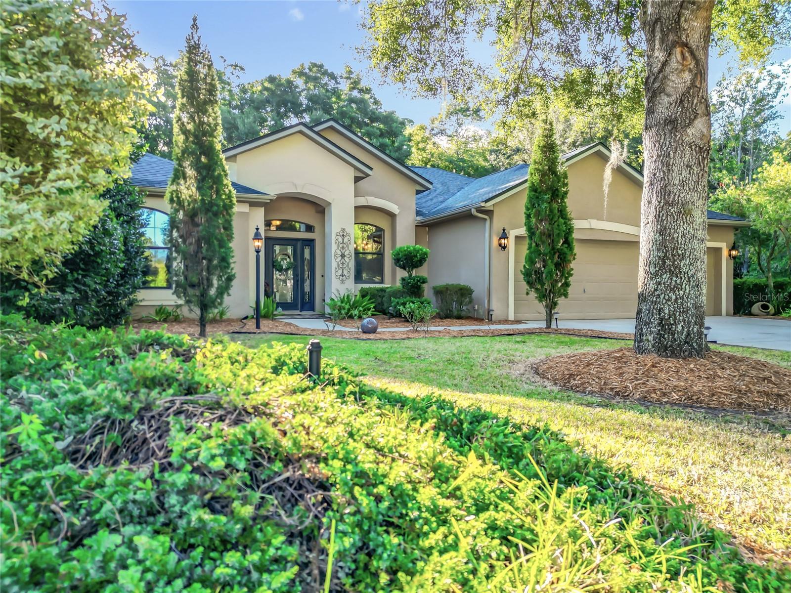 Experience Refined Living in Grand Park Village, Situated within the Esteemed Rainbow Springs Country Club Estates. This 2,119-Square-Foot CBS Home Features 3 Bdrms/2 Bthrms, 3-Car Garage, and an Expansive Screened-In Pool and Lanai w/Hot Tub. Situated on a .37-Acre Lot Offering Natural Privacy on Three Sides. Enjoy Professionally Designed Perennial Landscaping and Wooded Space at the Rear, Ensuring NO FUTURE DEVELOPMENT BEHIND YOUR HOME. This Greystone Model Includes these RECENT UPGRADES: ROOF (July 2024), POOL PUMP (2024), WATER HEATER (2024), IRRIGATION WELL PUMP (2025), And LVP FLOORING (2025). The Spacious L-Shaped Great Room Comprises Designated Dining, Living Area w/Gas Fireplace, Family Area, and Kitchen Area complete with Granite Countertops and Full Suite of Whirlpool S/S Appliances. The Master Ensuite Features Dual Walk-In Closets And Sliding Doors to the Screened Lanai and Pool Area with Hot Tub. Imagine Falling Asleep to the Soothing w/Sound of Your Pool Waterfall Feature. The Primary Bathroom Offers a Private Water Closet, Jetted Soaking Tub, Two Separate Vanities, And a Roman-Style Walk-In Shower w/Bench. The Backyard is Landscaped w/Tiered Levels and Stone Support Walls PLUS a Circular Stone Firepit! Residents Have Exclusive Access to their Private Beach and Park right on The Rainbow River that has these Amenities: Kayak Ramp, Picnic Pavilion, Swim Beach, Gazebo, Restrooms, BBQ Pavillion. AND your Amenities also include: Community Center w/Pool, Lighted Tennis Courts, Bocce Ball, Driving Range, Frisbee Golf, Billiards, and a Restaurant for only $44/month! For Additional Details, Please Request the Complete Features List and Video Link.