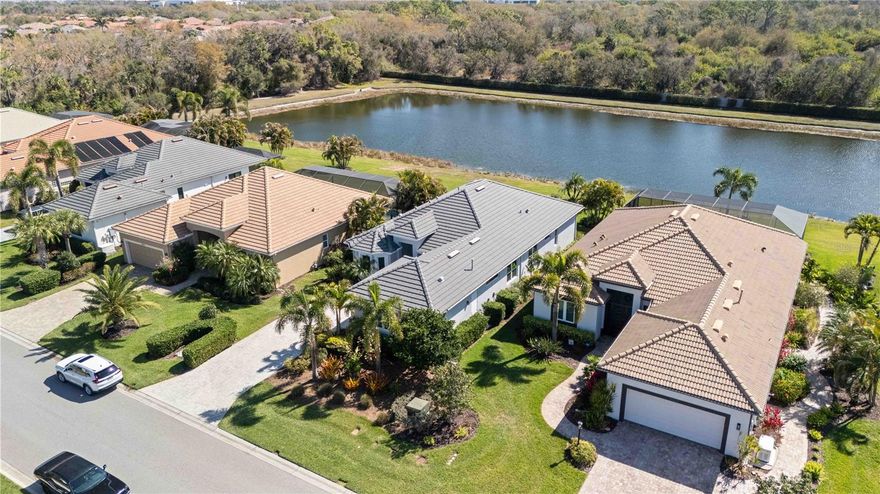 Owner is interested in BEST/REASONABLE OFFER! OWNER OFFERING 10,000 toward new lanai or closing costs!! ALSO, Owner financing possible with 25 percent down at rate below market rate with Strong credit rating. COME BY THIS WEEKEND! WATER VIEW Augusta model wiith a GORGEOUS KITCHEN!!! OVERSIZED ISLAND and UPGRADES! Set within the prestigious 24-hour guard-gated community of ROSEDALE Golf & Country Club—is where there are NO CDD fees and the lifestyle is elevated to an art form! This refined residence showcases soaring 12 FOOT CEILINGS, elegant 8-FOOT INTERIOR DOORS, DESIGNER TILE flooring, and a light-filled OPEN GREAT-ROOM layout designed for both sophisticated entertaining and comfortable everyday living. AND, EXTRA GARAGE STORAGE which can be used for your GOLF CART or storage! The CHEF-inspired kitchen with stainless steel appliances seamlessly connects to a custom fireplace and TV feature wall, while thoughtful UPGRADES—including luxury vinyl plank flooring, a professionally designed primary closet, built-in bookcase and curated shelving, designer window treatments, upgraded fixtures, and a premium HVAC UV light system—reflect meticulous attention to detail. Outside, enjoy a paver brick driveway and walkway, impact-resistant windows and doors, durable tile roof, retractable indoor lanai screen, gas hook up for a grill or outdor kitchen... lush professional landscaping, and full gutter system for long-term efficiency. The flexible floor plan offers 3 spacious bedrooms, a private den ideal for a home office or media retreat, 3 full designer baths, and a 2-car garage. Residents of Rosedale enjoy an active, resort-inspired lifestyle with GOLF, TENNIS, FITNESS CENTER, CLUBHOUSE DINING, heated Junior Olympic pool, bocce ball, vibrant social clubs, and year-round events, while the HOA provides exceptional value including manned gates, security, cable, high-speed internet, lawn care, community management, and common area maintenance. Perfectly positioned just beyond the gates are A-rated schools and quick access to Lakewood Ranch, UTC’s premier shopping and dining, medical facilities, gyms, I-75, Sarasota-Bradenton International Airport, downtown Sarasota, and some of the nation’s top-rated beaches including Siesta Key, Lido Beach, Anna Maria Island and more!—Experience luxury country club living at its finest.