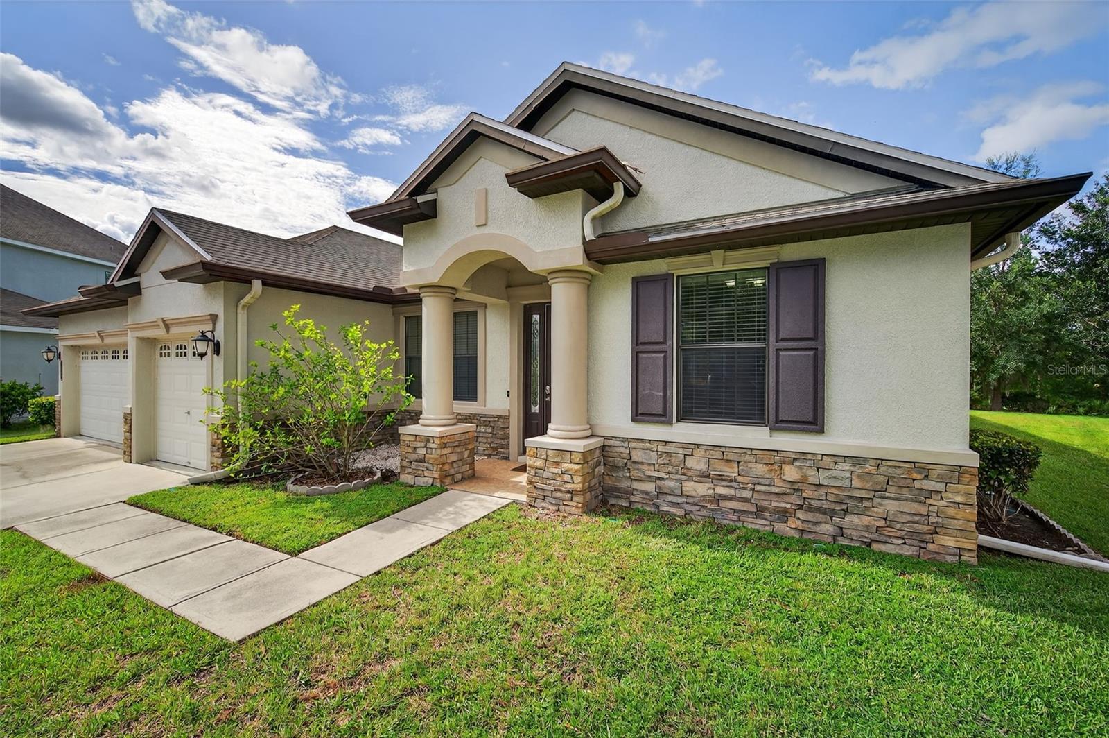 GRAND HAMPTON – Your Dream Home Awaits!
Tucked away in one of Tampa’s most sought-after 24-hour guard-gated, resort-style communities, this immaculate home in Grand Hampton offers the perfect blend of luxury, privacy, and space.
Situated on a rare oversized conservation lot (0.27 acres) with no rear neighbors, this 4-bedroom, 3-bathroom residence with a bonus room and dedicated office/flex space provides nearly 3,000 sqft of thoughtfully designed living space.
Step inside to soaring ceilings, elegant marble floors, and neutral paint that create a light, open, and sophisticated atmosphere. The spacious layout includes a separate formal dining room and an expansive kitchen/living combo perfect for both entertaining and everyday living.
The chef’s kitchen is a showstopper—featuring upgraded 42” cabinets with modern hardware, stunning granite countertops, a premium Wolf gas cooktop, custom pantry shelving. The split floor plan ensures maximum privacy, with the oversized primary suite tucked away for quiet retreat.
Upstairs, the bonus room currently serves as a home theater, offering the ultimate movie night experience or the perfect spot for a game room or second living area. The dedicated office adds even more flexibility for remote work, playroom, or library.
Step outside to your private backyard oasis—an oversized screened-in paver patio showcases a resort-style pool with Pebble Tec finish and shallow lounge area, perfect for cooling off on hot Florida days.
Additional features include:
Newer Roof (2020)
3-car garage with built-in storage
Water softener system
Ample closets and storage throughout
All this in the highly desirable Grand Hampton community, where resort-style living includes:
A luxurious zero-entry pool with water slide
Olympic-sized lap pool
Tennis, pickleball & basketball courts
Fully equipped clubhouse & fitness center
Playgrounds, walking trails, and open fields
Located just minutes from I-75 & I-275, Advent Hospital, Wiregrass Mall, Tampa Premium Outlets, top-rated schools, and more. CDD included in the tax bill!
This home truly has it all—space, style, and serenity. Don’t miss your opportunity to make it yours. Call or text today to schedule your private showing!