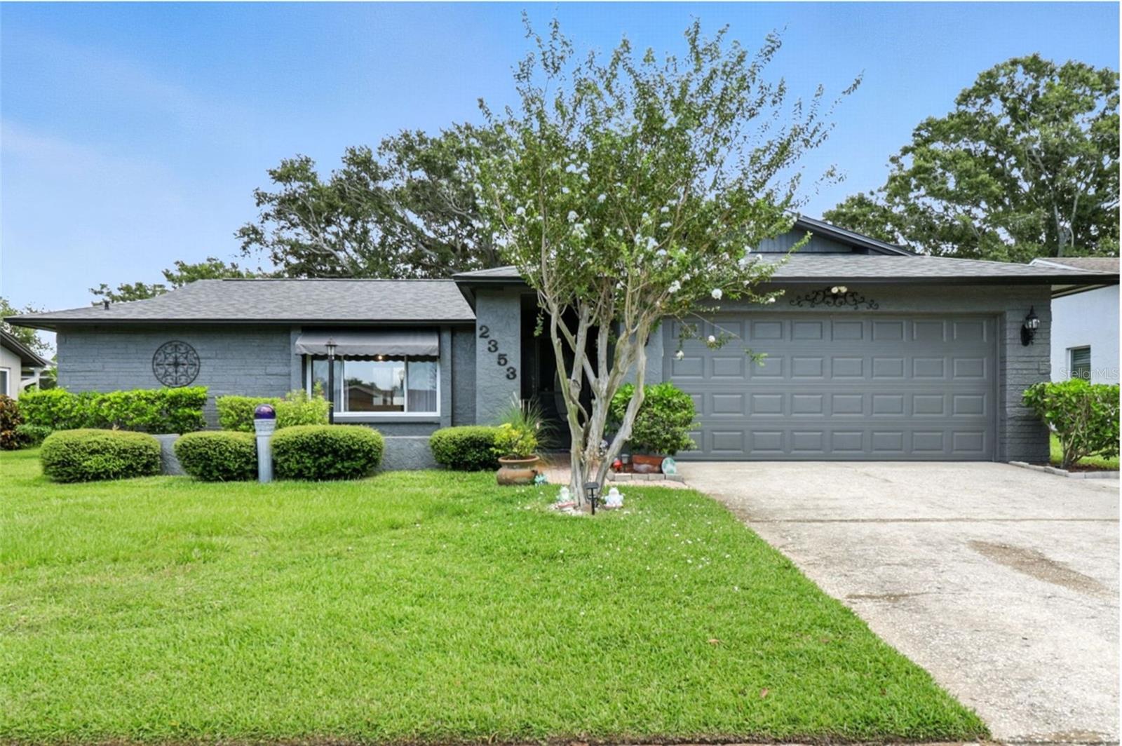 Welcome to your Florida dream home, perfectly situated in a highly sought-after location with unbeatable convenience and charm!
This beautifully maintained 3 bedroom, 2 bathroom residence sits outside flood and evacuation zones, offering peace of mind and practical living. The split floor plan provides privacy and functionality, with a spacious primary suite featuring a walk-in closet and private ensuite bathroom. Step inside to find durable ceramic tile and wood flooring throughout, no carpeting anywhere! The home features a BRAND NEW roof (2024), a large water heater (2022), a 2017 HVAC system, and a water softener, ensuring comfort and efficiency year-round. The backyard is your personal oasis, designed for relaxation and entertainment. Enjoy Florida living on the screened lanai, or host unforgettable gatherings on the expanded deck surrounded by lush landscaping. Located just minutes from world-famous beaches, top-rated schools, shopping, dining, hospitals, and public transportation, this home is also a commuter’s dream with easy access to Tampa International and St. Pete/Clearwater airports (15-30 minutes away). Nature lovers will appreciate being near Caladesi Island, parks, and endless outdoor activities. Best of all, Woodgate Park is right next door, offering pickleball and tennis courts, basketball courts, a playground, pavilions, picnic areas, BBQ grills, walking trails, and a sprawling open playfield, perfect for an active lifestyle. Don’t miss the chance to live in one of the most desirable neighborhoods. Schedule your private showing today!