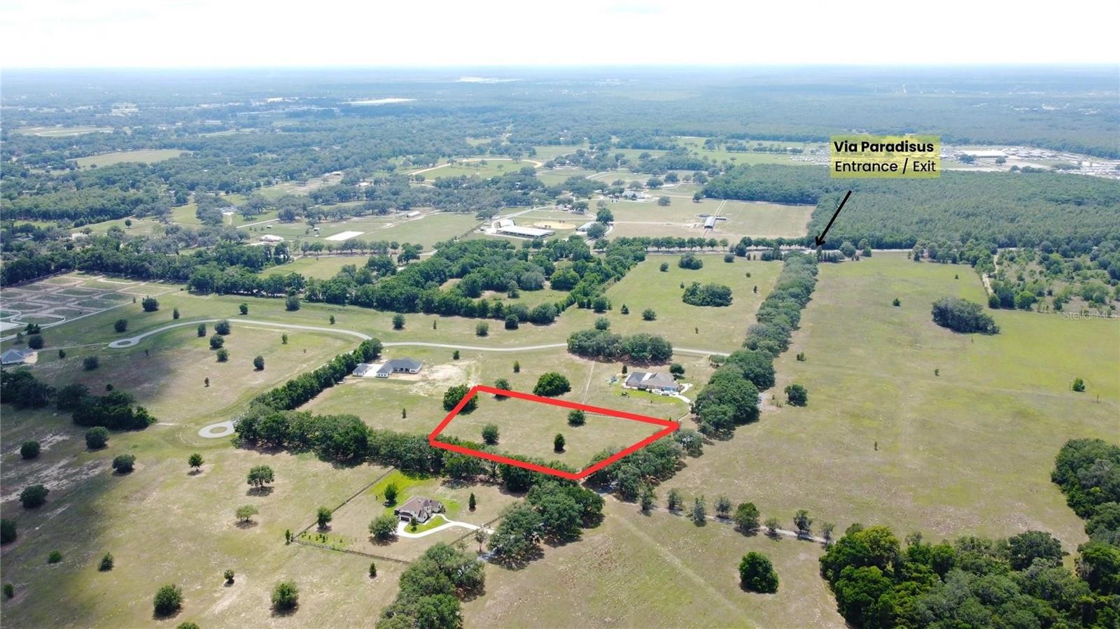 In the country, but convenient to everything, Via Paradisus is a horse-lover's paradise. Majestic golden gates with mature oak tree lined streets welcome you to this paradise in southeast Ocala. Offering just over 4 acres of clear countryside, this property is an inviting option for those looking for luxurious place to build their dream home. This high and dry parcel needs minimal site work for building. This deed restricted community offers direct access to the Florida Greenway’s miles of pristine trails. Or, ride your horses without every leaving the neighborhood thanks to myriad bridle trails.