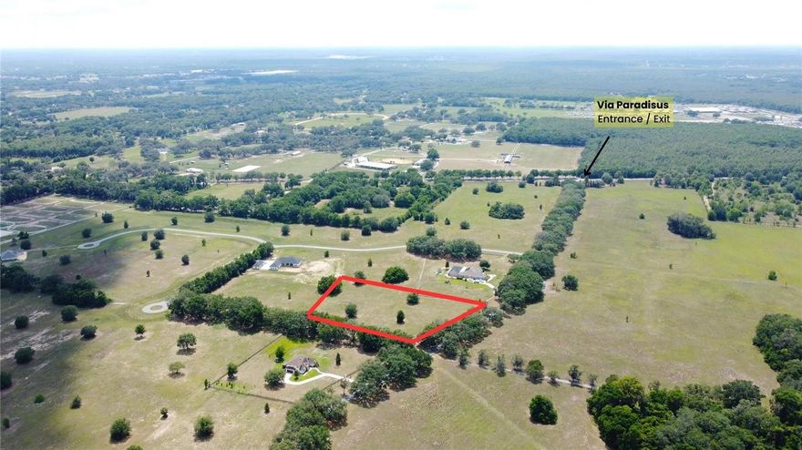 In the country, but convenient to everything, Via Paradisus is a horse-lover's paradise. Majestic golden gates with mature oak tree lined streets welcome you to this paradise in southeast Ocala. Offering just over 4 acres of clear countryside, this property is an inviting option for those looking for luxurious place to build their dream home. This high and dry parcel needs minimal site work for building. This deed restricted community offers direct access to the Florida Greenway’s miles of pristine trails. Or, ride your horses without every leaving the neighborhood thanks to myriad bridle trails.