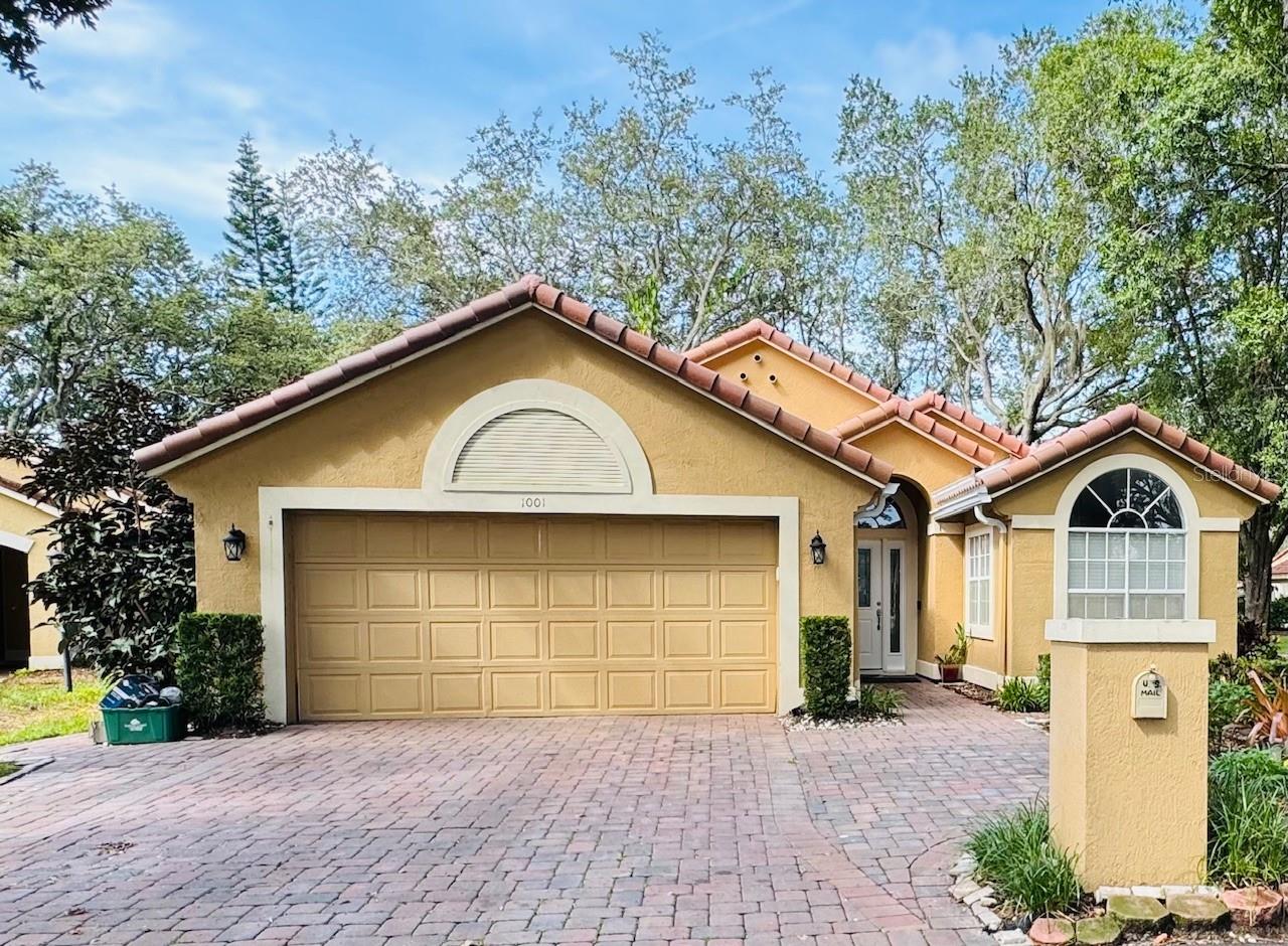 Lawn care included. Welcome to 1001 E Pebble Beach Circle, a beautifully renovated single-story home nestled in the heart of Winter Springs, FL. This 3-bedroom, 2-bathroom residence features a brand-new tile roof, soaring vaulted ceilings, and a spacious open layout that feels airy and inviting. Throughout the home, you’ll find durable tile and stylish vinyl wood flooring—no carpet in sight. The kitchen offers stainless steel appliances, a closet pantry, and a cozy eat-in nook perfect for morning coffee. The primary suite includes a generous walk-in closet and a sizable en suite bathroom, offering comfort and privacy.
Step outside to enjoy a serene screened-in back porch overlooking lush, professionally landscaped gardens—ideal for unwinding after a long day. This corner-lot home includes a washer and dryer, making move-in effortless. The surrounding neighborhood is quiet and welcoming, just minutes from the popular Tuscawilla Country Club, Bear Creek Nature Trail, and Trotwood Park, which features tennis courts, splash pads, and playgrounds. Local dining and retail options abound, including Publix, Target, and a range of charming cafes and restaurants like Café Panuzzo’s and Chick-fil-a. Families will appreciate the proximity to top-rated Seminole County schools, including Keeth Elementary, Indian Trails Middle, and Winter Springs High School. Easy access to SR 417 and other major routes, commuting is a breeze.