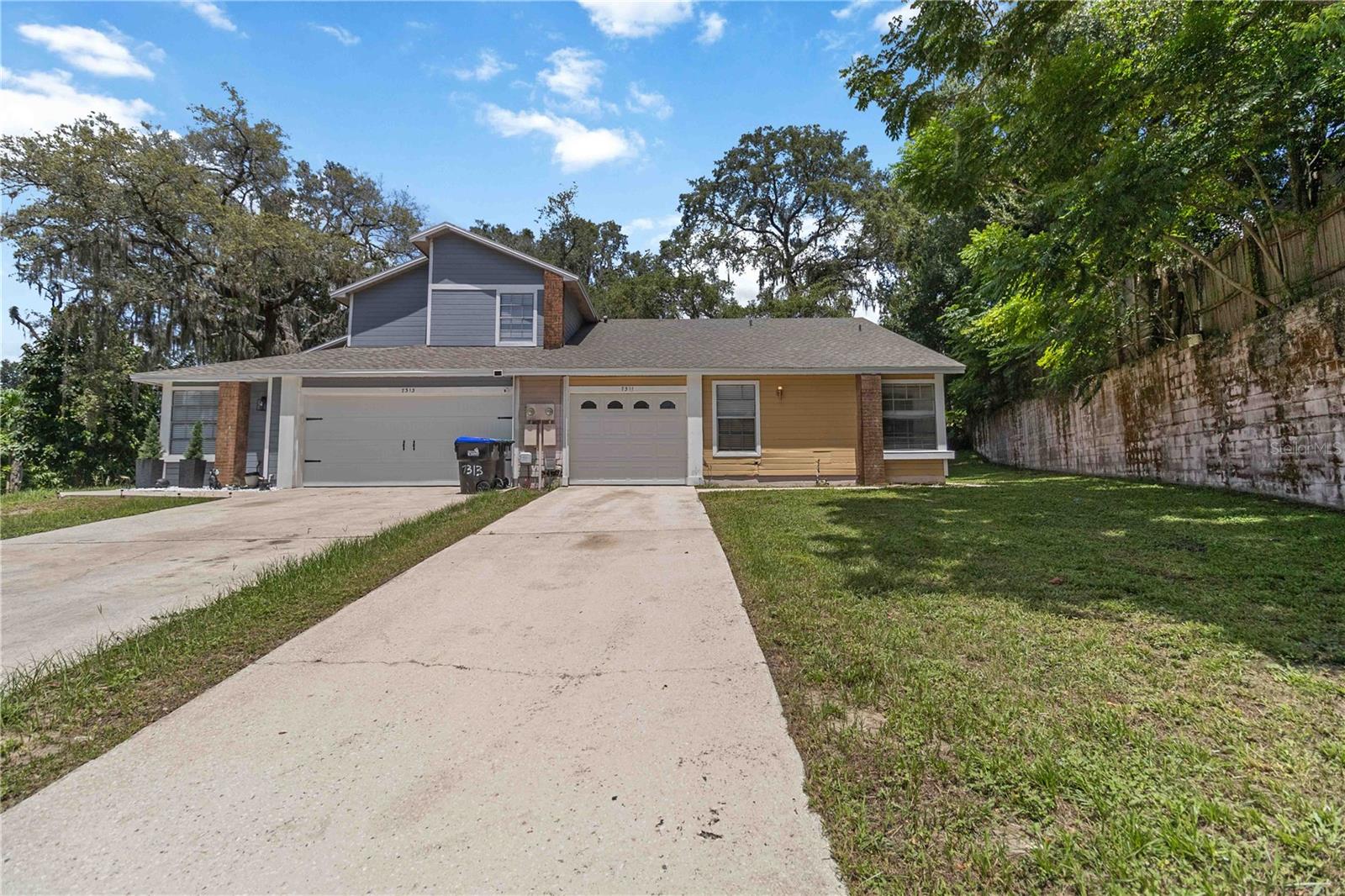 Location, location, location! AND NO HOA! Situated on a quiet cul-de-sac this 1/2 duplex is located between Old Winter Garden Rd and 50 with easy access to the 408 and the turnpike. Roof was replaced in 2019. Septic tank was replaced in 2019 and pumped and new filter in 2023. The floorplan offers a large livingroom/dining room combo with sliders to the covered lanai and the kitchen has a large closet pantry and eating nook. Primary bedroom has it's own bathroom with shower, side by side closets and sliders to the covered lanai too. Guest bathroom has a shower/tub combo. There's plenty of room for cars in the extended driveway. The lot is spacious and shaded which is great for our hot summer days. This home can be a real gem so bring your creativity and ideas to make this home yours! Investors: these units have great rental potential when fixed up averaging $1650 a month. Don't miss out on this opportunity!