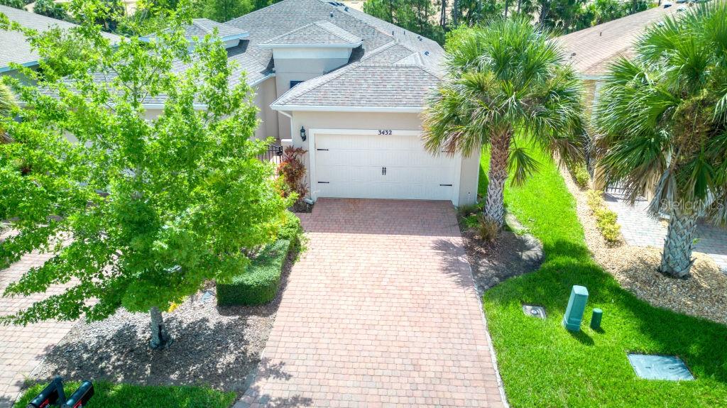 Move-in ready Avellino model, featuring a Courtyard entry to this 2 bedrooms,2 bathrooms plus a Den. Enter this Villa from a beautiful Leaded front door which allows the sun to shine in. This home affords large Tile throughout the home & laminate/tile flooring in the bedrooms (no carpet). The KITCHEN is light & bright with 42-inch uppers, granite counters, kitchen island & stainless steel appliance (stove purchased 2024).The PRIMARY suite affords a large window overlooking mature landscaping & TWO WALK-IN closets. The ENSUITE bathroom affords WALK-in shower, raised vanities with DUAL SINKS & stone counters. You will find custom window treatments from Hunter Douglas & custom White Plantation Shutters. RELAX in your Screened LANAI with a cup of coffee & enjoy the partial Pond view. Come view your new home today. Solivita is an active adult 55+ community located in Kissimmee, Florida. It is approximately 50 minutes from Disney World & the Orlando Airport. Solivita has a total of 5,470 homes. Approximately 10,000 people live in Solivita during the winter,approximately 7,500 during the summer. Solivita's amenities include: - a manicured SOFTBALL diamond & field - 36 holes of CHAMPIONSHIP GOLF that can be played by joining the Stonegate Golf Club or paying as you go - 2 STATE of the Art AMENITY centers with updated exercise equipment, yoga studio & meeting rooms - 3 restaurants - 14 HEATED POOLS - 17 PICKLEBALL courts - 9 TENNIS courts - 4 BOCCE BALL courts - 4 SHUFFLEBOARD courts - 3 HORSESHOE pits - a BILLIARDS room - miles of bike paths - 2 DOG PARKS (Small & Large Dogs) - Corn Hole - Tot Lot PLAYGROUND - COMMUNITY GARDEN - over 250 resident clubs. The HOA: - maintains the LANDSCAPING & IRRIGATION systems in the common areas as well as at individual homesites - maintains the roads throughout the community - PROVIDES SECURITY with gate guards and mobile patrols including the Polk County Sheriff - allows AUTOMATED GATE ACCESS for residents via license plate readers - provides residents with Fiber Optic Internet & TV service.***Poinciana Lakes Plaza is a MAJOR NEW SHOPPING CENTER that opened directly across from the Solivita Main Gate. It features Sprouts Grocery, TJ MAXX, Ross, Burlington, Rack Room Shoes, 5 Below, Ulta, Outback, First Watch, 5 Guys, Urgent Care, Dentist, TD Bank, Petco & Hair Cuttery PLUS MORE TO COME.***