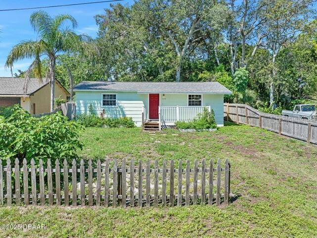 Adorable 2-bedroom, 1-bath home in Daytona Beach with numerous upgrades! This property features a new roof (2021, permitted), new windows, newer well pump, updated plumbing, and an updated bathroom. The kitchen has been beautifully remodeled with shaker cabinets, and the home offers wood flooring throughout. Inside laundry with washer & dryer included adds convenience. Enjoy relaxing on the charming front porch or private rear porch. Perfect for a first-time buyer, investor, or anyone looking to downsize! Information recorded in MLS is intended to be accurate but cannot be guaranteed. Everything should be independently verified