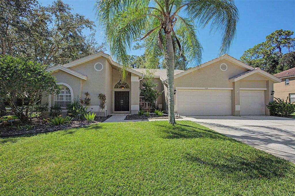 Photo of 1558 E Lake Woodlands Parkway, Oldsmar, FL 34677 (MLS # TB8557574)