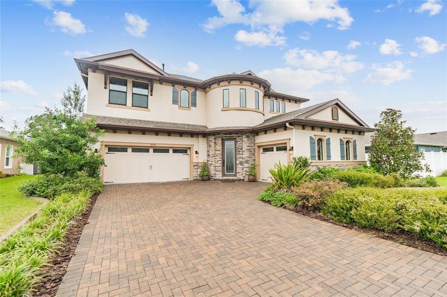 GORGEOUS MOVE IN READY HOME with tons of upgrades!!! There's plenty of space for your family in this 5 bedroom, 4 1/2 bath, 2 story home with an open living floor plan that includes a Grand Room with gas fireplace and surround sound speakers, gourmet kitchen with maple wood cabinets, gas appliances, and walk in pantry, and dining area with extra cabinetry, perfect for entertaining! Enjoy the outdoors and pond view in your screened in heated pool with waterfall grotto, relaxing on your sun shelf, in the shade of the huge covered lanai with surround sound speakers, or grilling in your outdoor kitchen with bar seating. There's even a screened in balcony on the second floor connected to an oversized bonus room! The backyard is fenced in with plenty of space for pets and even a garden. Lakeshore Ranch offers 3 pools, tennis courts, a basketball court, Club House, Fitness Center, Business Center, playground, fishing dock, and a dog park!