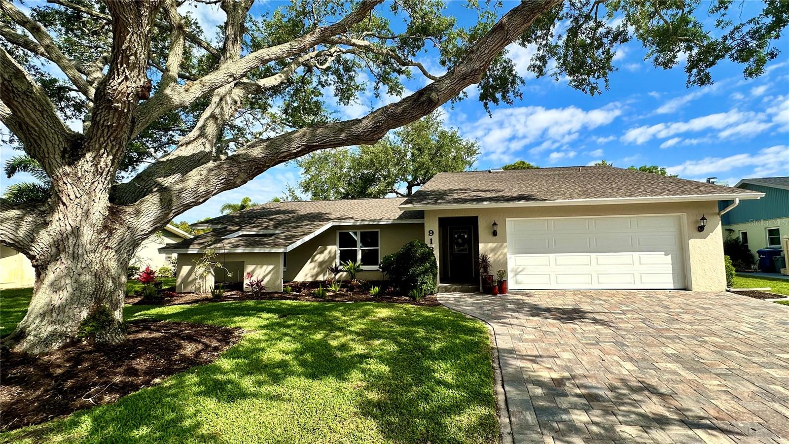 Welcome to your dream home at 913 South Doral Lane, a beautifully renovated residence that combines modern elegance with unparalleled comfort. This exceptional property, nestled on the prestigious Jacaranda West Country Club, offers a serene retreat with breathtaking views of a tranquil pond and the meticulously maintained golf course.
Spanning 2,298 square feet, this home features an open concept layout designed for contemporary living. The family room, with its vaulted ceilings, skylights, and cozy fireplace, creates an inviting atmosphere perfect for relaxation and gatherings. The removal of popcorn ceilings throughout the house adds a sleek, modern touch.
The heart of this home is the remodeled kitchen, equipped with stainless steel appliances, granite-topped cabinets, and a massive center counter space that will inspire your culinary adventures. The split floor plan includes three spacious bedrooms ensuring privacy and comfort. The primary bedroom boasts an ensuite bathroom with dual vanities, a walk-in shower, and two walk-in closets, offering a private oasis after a long day.
Both bathrooms are fully updated with walk-in showers and dual vanities for added convenience.
Step outside to the enclosed Florida room with fully retractable sliding doors that lead to a screened patio lanai. Here, breathtaking views of the pond and golf course await, offering serene moments of relaxation. The property is framed by mature landscaping and two majestic oak trees, enhancing its curb appeal.
Recent upgrades include a new paver driveway, garage door, windows, electrical updates, A/C unit, and roof—ensuring peace of mind for years to come.
With its over-sized garage and strategic location on a golf course community, this home represents an unparalleled opportunity to live in luxury and comfort. Don't miss out on making 913 South Doral Lane your new address! Bedroom Closet Type: Walk-in Closet (Primary Bedroom).