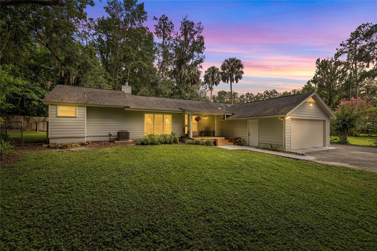 Adorable 3/2 home in a private setting with no HOA!! This home is in an ideal location in Ocala and has so much to offer!! Open floor plan, with the primary suite split from the other two bedrooms. Mature landscaping on half an acre. Surrounded by gorgeous horse farms and across the street from the stunning Polo Lane Subdivision, this home gives you a sense of privacy, but is still close to everything! The outdoor gazebo allows for extra entertainment space and is an excellent place to relax. Both bathrooms are spacious and updated, the indoor wood burning fireplace will keep you warm & cozy! This home has tons of natural light from the large windows and skylights. Multiple updates including, windows, AC, water pump, well, water heater.