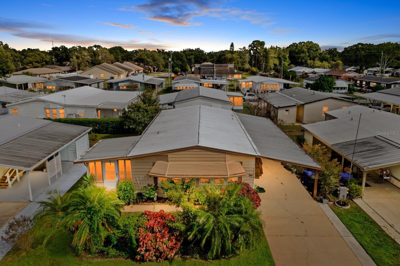 Welcome to Foxwood Lake Estates, a highly sought-after 55+ community where you own the land! This beautiful 2-bedroom, 2-bath home offers a spacious open floor plan featuring a large breakfast bar that seamlessly connects the kitchen, dining, and living areas—perfect for entertaining. The kitchen is a true highlight, showcasing all-wood cabinets, soft-close drawers, quartz countertops, and stainless steel appliances. Stylish laminate flooring flows throughout the main living spaces, adding warmth and easy maintenance.
Enjoy extra living space in the comfortable Florida room with acrylic windows and air conditioning (not included in the 1,352 sq. ft. of living area), plus an additional screened room that wraps around the storage area—ideal for a workshop, hobby space, or relaxing retreat. Residents can take advantage of a variety of amenities, including a spacious clubhouse, game and billiards rooms, fitness center, library, sauna, and a heated pool with hot tub. Outdoor recreation abounds with pickleball, shuffleboard, bocce ball, basketball, and horseshoe courts, plus a scenic paved walking trail that winds around the lake.
There’s always something happening here—from social gatherings and themed dinners to live entertainment, dances, fitness classes, and holiday celebrations. Whether you enjoy morning coffee with neighbors, pool aerobics, Zumba, or golf cart parades, this friendly community offers an abundance of ways to stay active, social, and engaged year-round.