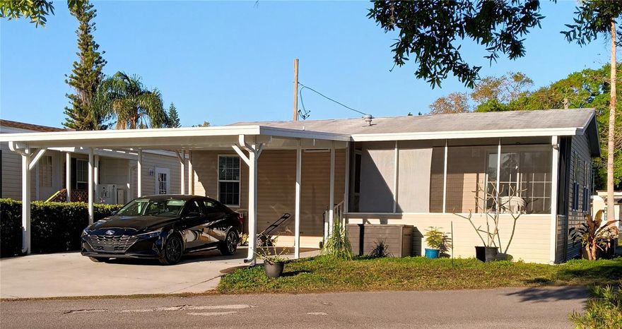 Built in 2018 this two-bedroom, two-bathroom double-wide manufactured home is located in the private, gated Lake Como Resort. This is a
nudist community and to be considered for residency owners are required to be members (or become members) of AANR - the American
Association for Nude Recreation. This lovely home is considered "Real Property" because a Certificate of Ownership in the Lake Como Coop is
included, along with the extensive benefits of being an owner. Features include: a large carport and double-wide concrete drive, a screened
porch facing the lake and the pickle ball courts; an open floor plan with a kitchen, a breakfast bar and adjacent living room; ceiling fans throughout; laminate flooring. The community has its own lake, a large in-ground pool, 5 Har-Tru clay tennis courts, 4 pickle ball courts, sand & grass volleyball, a restaurant, a bar... lots of great trails to walk or bike.