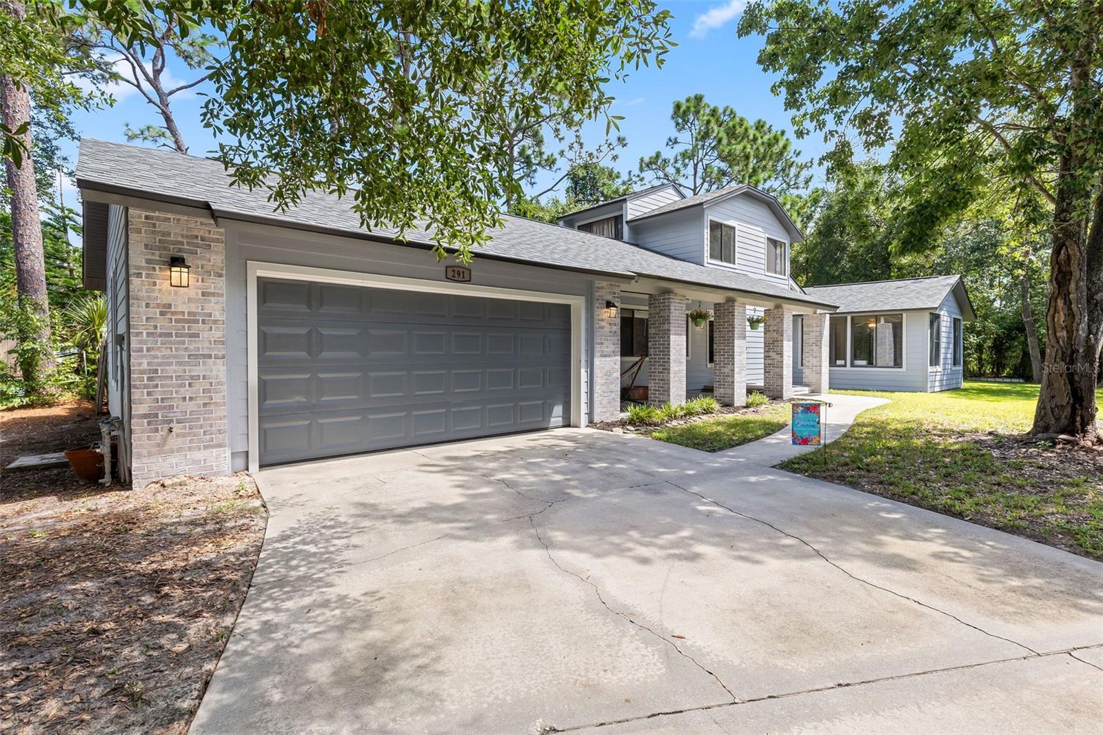 Welcome to Tymber Creek, a gated, highly sought-after community where charm and comfort meet. This two-story home is tucked into a welcoming neighborhood and offers peace of mind with concrete Hardy board siding, new windows, a new roof, two new HVAC systems, and a new hot water heater. The upgraded siding not only adds lasting durability but can also mean big savings on homeowners insurance. The main level boasts beautiful flooring, a massive primary suite, a sun-filled dining room, and a show-stopping floor-to-ceiling fireplace that feels straight out of a cozy mountain lodge. The kitchen flows seamlessly to the sunroom, perfect for year-round enjoyment. Upstairs you’ll find two additional bedrooms and a full bath. Outside, the front porch delivers major Cracker Barrel vibes, ideal for sipping lemonade or coffee for years to come. Situated on a quiet cul-de-sac with a two-car garage, this home is close to dining, shopping, top-rated schools, interstate, medical facilities, the beach, the river, and so much more. The community offers a pool, tennis courts, beautiful streets for walking or biking, and even boat or RV storage for a nominal fee. All information obtained from the tax rolls and seller and, while deemed reliable, cannot be guaranteed
