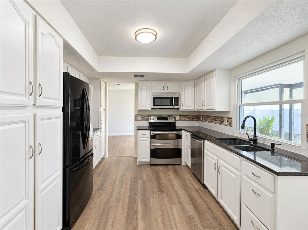 Photo of 8421 Cypress Lake Circle, Sarasota, FL 34243 (MLS # O6453999)