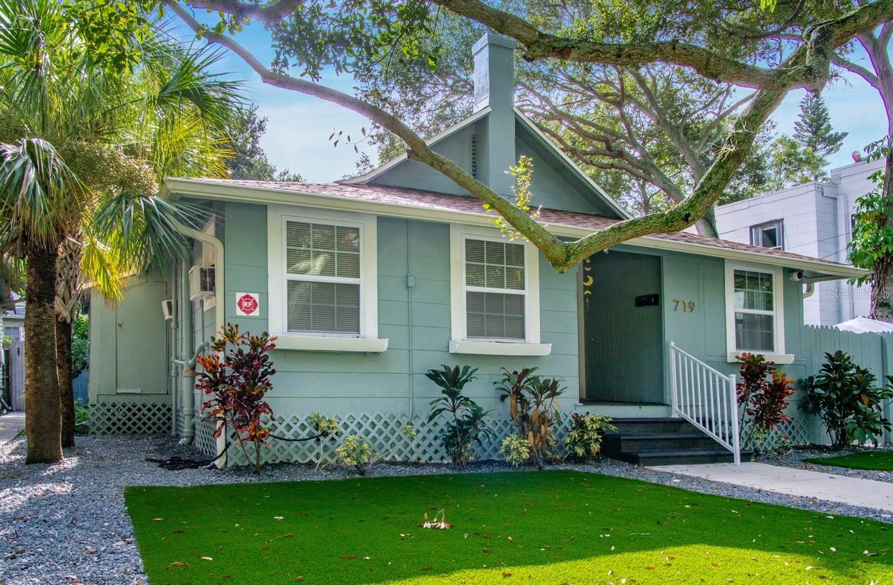 Welcome to your four-door ticket to flexibility, style, and serious income potential in one of St. Pete’s most beloved and walkable neighborhoods. Tucked beneath the oaks of Historic Uptown, this rare setup offers multiple ways to live, host, and earn, whether you’re house hacking, investing in STRs, or building a long-term rental portfolio. The main home is a charming 2 bed / 1.5 bath perched above a 3-car garage, featuring hardwood floors, an updated kitchen, central AC, and private fenced yard. Up front, a detached triplex offers a sunlit 2 bed / 1 bath unit with updated kitchen and central AC, a 1 bed / 1 bath unit with vaulted ceilings and updated systems, and a stylish studio with a renovated kitchen, tankless water heater, and modern finishes. The property has over $100k in recent updates, including landscaping, fresh paint in and out, plumbing and electrical upgrades (all on individual meters), new AC units, windows, and so much more! Outside, you’ll find a 2-car carport, green space with dog-friendly turf, and alley access perfect for tenants and guests. Whether you live in the main house and rent the rest, lease all four, or mix it up with short- and long-term stays, the layout offers total flexibility and privacy. Vintage charm meets modern ease throughout, and the location supports your vision. You're just blocks from Central Ave, Round Lake, Crescent Lake Park, and local favorites like Black Crow Coffee, Craft Kafe, Uptown Eats, and everything downtown St Pete has to offer. You’re close to the water, close to the action, and tucked away just enough. This is not your average multifamily, it’s a vibe. A compound. It’s an income-producing compound with heart, soul, and a story. Book a showing and make it yours.