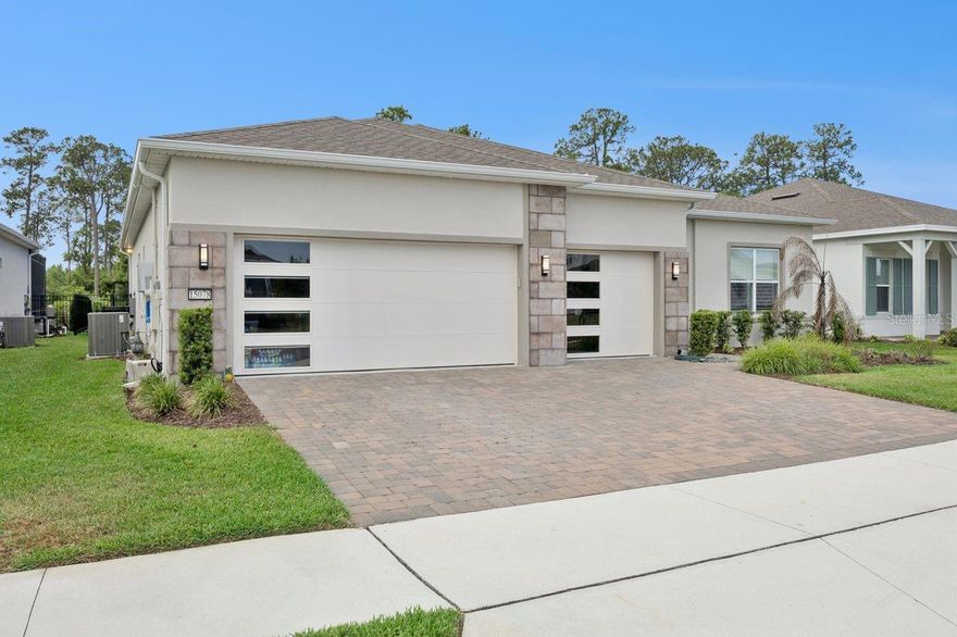 This is it—the one buyers wait for and rarely catch in time. One of the final opportunities to own in Del Webb Oasis, a highly sought-after 55+ community by Pulte Homes, where lifestyle isn't an upgrade—it's built in.

This extended Stardom Echelon isn't just a home—it's a fully dialed-in experience. Thoughtfully expanded and meticulously upgraded, it offers a private heated pool and extended lanai, creating a backyard designed for morning coffee, evening wine, and everything in between. The backyard view is pure nature—a lush tree line that provides a true sense of privacy with no rear neighbors in sight. The outdoor kitchen, electronic blinds, and fully fenced yard elevate both privacy and ease. And for those who appreciate a well-appointed bar setup, a custom coffee and bar station was added by the owner—a thoughtful touch not included in the original kitchen build.

Inside, natural light pours into open living spaces anchored by a gourmet kitchen with an oversized island, built-in cabinetry, upgraded tile and flooring, and high-end appliances including a Samsung refrigerator. Every detail has been considered—from custom shelving throughout (primary suite, pantry, laundry, study, even garage entry) to a built-in vacuum system and in-wall pest control. The extended 3-car garage with epoxy floors and added storage offers the space you actually need—and even comes prepped for a whole-home water filtration system, ready for the next owner to complete.

And then there's the community. Del Webb Oasis is where neighbors become friends and every day feels like a getaway—resort-style pool and spa, pickleball and tennis, a stunning clubhouse, fitness center, exercise equipment along the walking path trail and Parkette, fire pits, social clubs, and curated events. Lawn care is handled, so your time is truly your own.

All just minutes from Walt Disney World Resort, Hamlin Town Center, and Downtown Winter Garden—with easy access to everything Central Florida offers.

Homes like this don't come back around—especially not in communities like this. This is your chance to step into the next chapter, already fully upgraded and ready to enjoy from day one.
