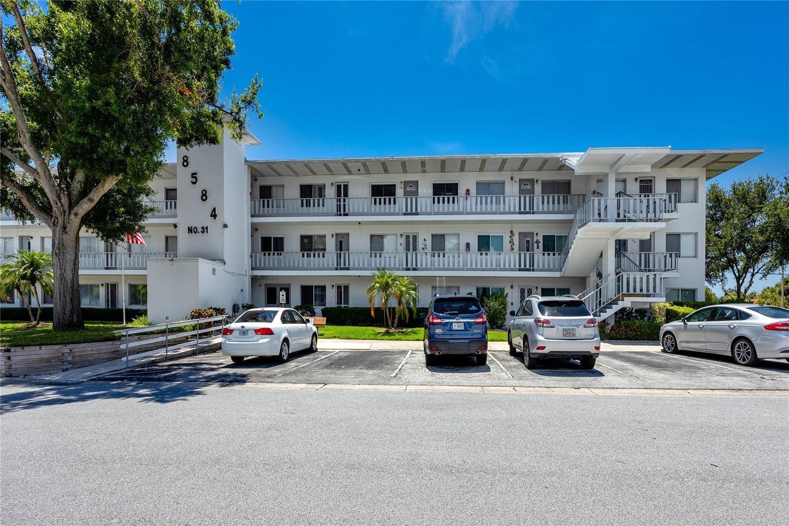 Welcome to this beautifully updated and partially furnished third-floor condo, just steps from the building elevator in the highly desirable 55+ community of Seminole Garden—where comfort, convenience, and an active lifestyle meet in a peaceful, well-maintained setting. This move-in ready home features a functional open layout with modern upgrades and stunning sunset views.
Since 2015, the entire unit has undergone thoughtful renovation, including a fully updated kitchen with elegant hickory wood cabinets, quartz countertops, Bosch dishwasher, new microwave and stove, and a deep sink with a modern faucet. The drop ceilings in the kitchen and bathroom were removed to create a more spacious feel. The bathroom also boasts a stylish updated vanity and beautifully restored tilework.
Tile flooring flows through the main living areas, while both bedrooms offer carpet for added comfort. The spacious primary bedroom includes a generous 8x5.5' walk-in closet. The second bedroom—ideal as a guest room, office, or den—opens directly to the enclosed back lanai. This relaxing Florida room features sunroom-style sliding windows, garden views, ceiling fans, and a storage closet—perfect for morning coffee or evening reading.
Additional upgrades include a 2018 electric panel with a whole-house surge protector, hurricane-impact front door and windows, double-pane rear windows, new ceiling fans throughout, and the option to purchase select furnishings with the unit.
Seminole Garden offers resort-style amenities: a heated year-round pool, hot tub, sauna, clubhouse with events and classes, and nature paths winding past scenic ponds and fountains. A free community shuttle stops right outside the building for easy access to shopping, banking, and more.
Located just steps from Seminole City Center and a short drive to Madeira Beach, Redington Beach, and Treasure Island, this condo offers the perfect balance of quiet retreat and active Florida living. Schedule your private showing today!