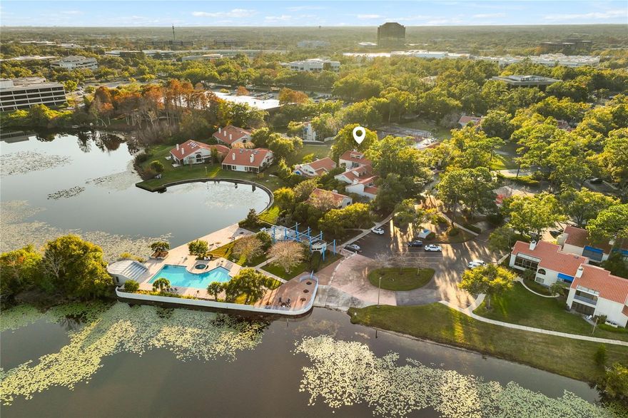 Wake up to water views, an abundance of natural light, and tropical serenity in this beautifully appointed, private ground-floor residence.
Embrace a calm, relaxing lifestyle in this light-filled, ground-floor condo surrounded by lush tropical landscaping, located in Maitland’s popular gated community of Sun Bay Club. Designed for effortless living, this spacious 3-bedroom, 2-bath residence offers a rare no-stairs layout and exceptional privacy, set on a desirable lot with no direct rear neighbors and tranquil pond views both behind and to the side.
The elegant living area is anchored by a wood-burning fireplace, and flows through French doors into a sunlit, enclosed Florida room,  with expansive windows and sliding glass doors—perfect for morning coffee, evening relaxation, or entertaining while enjoying serene, tropical surroundings. Sliding glass doors in the primary bedroom and kitchen open directly to the Florida room, enhancing the indoor-outdoor lifestyle. The kitchen features beautiful quartz countertops, stainless steel appliances, and a charming breakfast nook overlooking the pond, creating an inviting space to start each day.
The second bedroom opens to a private patio with peaceful water views, while the third bedroom faces the front and offers flexibility as a home office, playroom, or guest retreat. LVP and ceramic tile flooring, abundant storage, and a thoughtfully designed layout provide both comfort and sophistication.
Meticulously maintained with evident pride of ownership throughout.  Recent upgrades include a newer A/C (2022) and a brand-new hot water heater (2025), newly painted areas interior.  Enjoy the ease of walking to the community pool, lakes, and tennis courts, while coming home to a quiet, private setting.   Centrally located just minutes from I-4, Winter Park, the beaches, the parks, hotels, dining, and shopping.   Call today for your showing appointment!