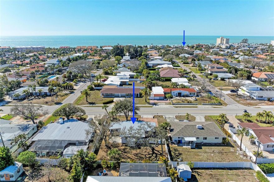 Own a piece of Golden Beach just two blocks from private deeded beach access — all outside the flood zone.

Welcome to 817 Harbor Drive S, where Old Florida charm meets thoughtful mid-century modern updates in one of Venice Island’s most coveted neighborhoods. Whether you’re looking for a beach getaway, a vacation rental opportunity, or a prime homesite in Golden Beach, this property offers flexibility, character, and location all in one.

Step inside and you’ll immediately feel the warmth — restored original terrazzo floors, vaulted ceilings with exposed wooden beams, and natural light pouring in through the sunroom create a relaxed coastal atmosphere that feels both timeless and inviting. The open living space flows effortlessly, offering room to gather, unwind, or host guests after a day at the beach.

The updated kitchen features granite countertops, stainless appliances, and clean finishes that blend seamlessly with the home’s mid-century personality. New interior doors and baseboards elevate the overall feel, while a brand-new roof (2025) and Impact windows adds peace of mind.

The primary bedroom offers private patio access — perfect for quiet mornings with coffee under the oak trees. A second bedroom provides flexibility for guests or family. The glass-enclosed sunroom adds additional living space, ideal for a home office, reading nook, or overflow guest area.

Outside, the oversized fenced backyard is a rare find on the Island — complete with a large patio for entertaining, mature landscaping for privacy, and two storage options for beach gear and bikes. The carport provides shaded parking and convenient access.

Golden Beach residents enjoy private deeded beach access just a few blocks away — meaning peaceful Gulf sunsets without the crowds. Located on Venice Island, you’re also just minutes to Sharky’s Pier, the public beach, boutique shopping, dining, and the charm of Historic Downtown Venice.

Whether you preserve and enjoy this classic coastal cottage, generate vacation rental income, or build your custom dream home in one of the Island’s premier neighborhoods — the value here is undeniable.
Venice Island living, private beach access, no flood zone, and Golden Beach prestige — this is the opportunity buyers wait for.