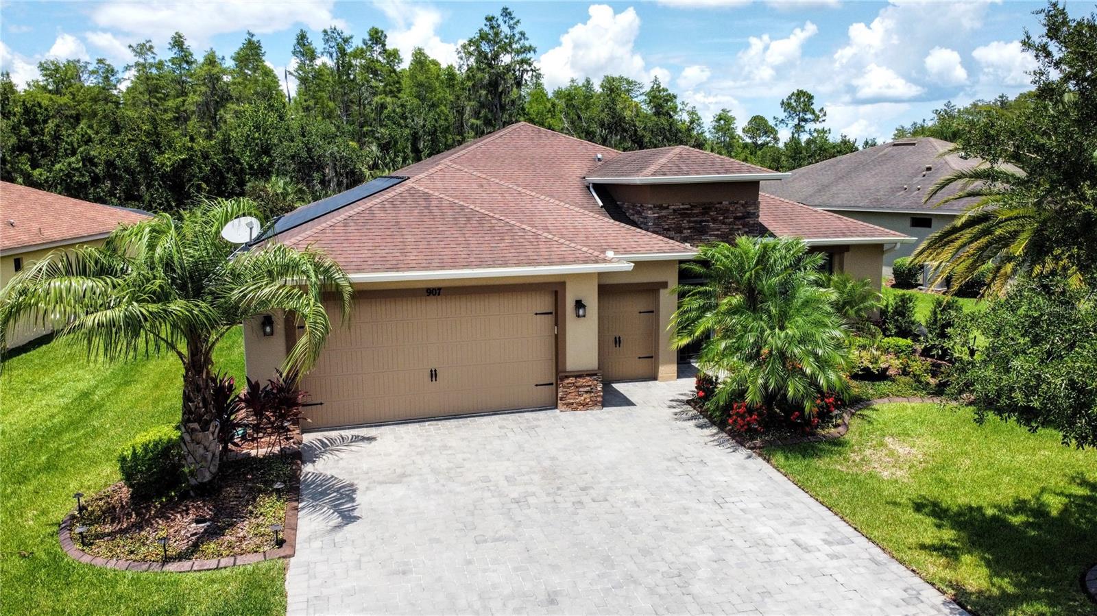 This SPECTACULAR, EXPANDED BOCA GRANDE model has a POOL, SOLAR PANELS (Paid Off) & a GOLF CART GARAGE and is located on a private, lush CONSERVATION lot in the Vizcaya subdivision of Solivita. ** See FULL LENGTH VIDEO of home on Tour Link 1.** 8' Doors, 5.25" Baseboards, Rounded Corners on the walls, TILE flooring and UPGRADED LIGHTING, electrical outlets & CEILING FANS throughout. PLANTATION SHUTTERS in Primary Suite, 2nd Bedroom & Den. SURROUND SOUND speakers in Foyer, Primary Suite, Great Room & Den. Front exterior of the home has ARCHITECTURAL STONE accents and LANDSCAPE CURBING around the flower beds with LOW WATTAGE lighting. The entryway is screened and the front door has a CUSTOM LEADED GLASS INSERT. This home has the whole ENERGY EFFICIENCY package to include: *11.22 KW Roof Mounted 2019 SOLAR ELECTRIC system that is paid for *TRANE 20 SEER MULTIPLE ZONE HVAC new 2020 * Icynene spray foam in the attic ceiling *Core foam insulation in the exterior cinder block walls * Double pane windows & slider The centerpiece of the home is the AMAZING 12' X 31.5' POOL with SOLAR & ELECTRIC heater/chiller, SENSE & DISPENSE automatic SALT system, stunning WATERFALL, BUBBLERS, LAMINAR DECK JETS that spout from 2 corners of the pool & LED multiple color LIGHTING. Florida Room has a Type II covered enclosure with a FOUR PANEL slider that open to the pool area. This 210 SF (under original roof) + 90' integrated Florida Room extension has PLANK TILE flooring and is cooled/heated with a 2014 mini-split HVAC. Kitchen features GRANITE Counters & Backsplash! Large GRANITE ISLAND w/ seating. 42" UPPER CABINETS w/ Crown Molding & Trim, above & below cabinet LED lighting (ability to change colors) and PULL-OUT DRAWERS in the lower cabinets. SLIDE-IN STAINLESS STEEL Convection RANGE, 2022 LG ThinQ COUNTER-DEPTH Refrigerator, CONVECTION Microwave new in 2023 & Low Decibel Dishwasher new in 2022. GREAT ROOM features RECESSED LIGHTS and COLOR LED LIGHTS. DEN boasts RAIN GLASS INSERT double doors. PRIMARY SUITE is large with PLANK TILE FLOORING, Recessed Lighting & a WALK IN CLOSET. Primary Bathroom has two RAISED VANITIES, Upgraded shower with Bench & SEAMLESS GLASS Enclosure. 2nd Bedroom has an Ensuite Bathroom including a remodeled shower with a TYVARIAN granite like finish which is mold and mildew resistant. Granite Counter in bathroom. Large LAUNDRY ROOM boasts a WASH BASIN & PLENTY OF OVERHEAD CABINETS. Garage is 25' in length with its 4' EXTENSION. Its floor is painted with EPOXY & CONFETTI CHIPS. Overhead STORAGE RACKS PLUS wall mounted Cabinets and cabinets at floor level. WHOLE HOUSE WATER FILTER and a separate WATER SOFTENER. This home is MAXED out with upgrades. Call us for a showing. Make it yours today!