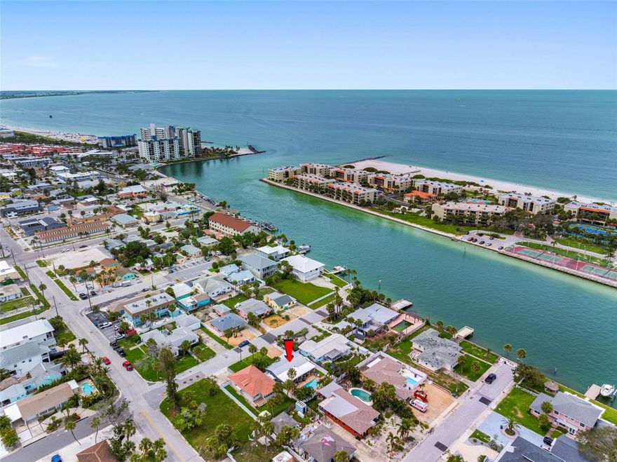 PRICE IMPROVEMENT....Live the Dream in St. Pete Beach!  This beautifully renovated 2-bedroom, 2-bath residence blends comfort, style, and vacation living within a few blocks of award-winning beaches, Corey Avenue restaurants/shopping, and fishing at the end of the block!  Step inside to a bright, open-concept layout filled with natural light. The spacious living, dining, and kitchen areas flow together seamlessly - perfect for entertaining or relaxing with family and friends. The kitchen is a chef’s delight with new soft-close cabinets, beautiful quartz countertops, abundant storage, and brand-new stainless-steel appliances. Both bedrooms provide peaceful retreats, with the primary suite offering enhanced privacy and a serene atmosphere.  Enjoy the beauty of newer wood grain porcelain tiles throughout, and plantation shutters add charm and energy efficiency.  Hurricane rated windows new in 2024.  New, removable hurricane panels provide rock-solid durability and easy set-up and qualify for substantial insurance discounts. 
Step outside into your private tropical oasis.  Enjoy a refreshing swim in the saltwater therapy pool or lounge beneath the insulated lanai roof added in 2020.  Surrounded by pavers and lush, mature landscaping, the backyard is ideal for soaking up the Florida sunshine.  This home is packed with valuable upgrades including a durable, energy-efficient, wind and fire resistant, low maintenance metal roof installed in 2018, a new electric panel and water heater, and an AC system also new in 2018. The attic received spray insulation the same year, and the garage is insulated and features a mini-split system for year-round comfort.  Complete update and interior refresh in 2025, all work done under permits and performed by licensed contractor.   Just steps from a peaceful waterfront park—perfect for evening sunsets.  Whether you're looking for a full-time residence, a seasonal getaway, or an income-producing property, this St. Pete Beach gem checks every box. Don’t miss your chance to own a slice of paradise. Schedule your private showing today!
