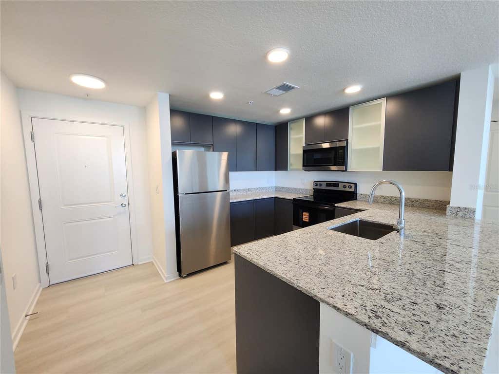 Photo of 5563 Milenia Park Boulevard #221, Orlando, FL 32839 (MLS # O6425948)