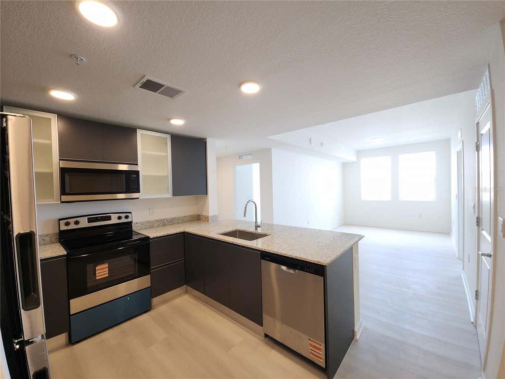 Photo of 5563 Milenia Park Boulevard #221, Orlando, FL 32839 (MLS # O6425948)