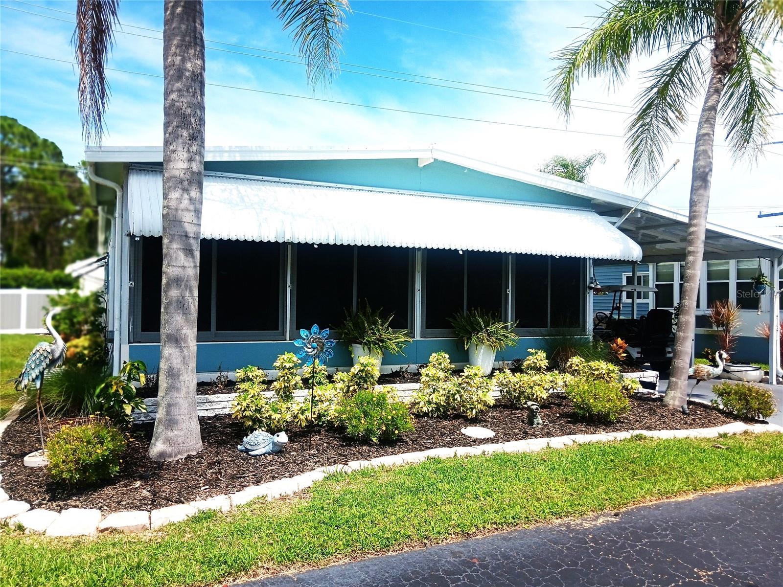 AN ARBORS BEAUTY in one of Florida’s most-sought-after 55+ parks. You won’t believe how BIG and BEAUTIFUL this home is !! Over 1,152 square feet of centrally-cooled comfort. Large living room. New laminate flooring. A chef’s kitchen. Comfy throughout. 2 LANAIS: (1) Front lanai with new windows and new tile flooring; (2) Side lanai is carpeted, screened and ready for relaxing. Both lanais add more living space. Private Paved Patio 30x14 in the back yard . You’ll get more rest and relaxation. New attached work shed with lots of extra storage space. Attached laundry with washer and dryer plus more storage space. DOG-FRIENDLY zone up to 35 pounds. HERE ARE THE DETAILS: Open floor plan with kitchen, dining area and living room spaced perfectly. All kitchen appliances are FREE. New hurricane windows throughout. Master bedroom has 2 walk-in closets and attached sparkling bathroom with bathtub. The guest bedroom has a Murphy Bed and 2 walk-in closets. Plus the hallway has a full bath. Beautifully landscaped with night lighting. THE ARBORS provides a pool, pickleball court, clubhouse with many social events for you and your fun-loving, sun-loving neighbors: parties, annual flee market, bingo, poker nights, and more and more and more . . . . You will have A SHORT DRIVE TO Walmart, Publix, drug store, restaurants, places of worship, post office and ONLY 10 MINUTES TO NOKOMIS BEACH !! The HOA fee is a low $215/month.
