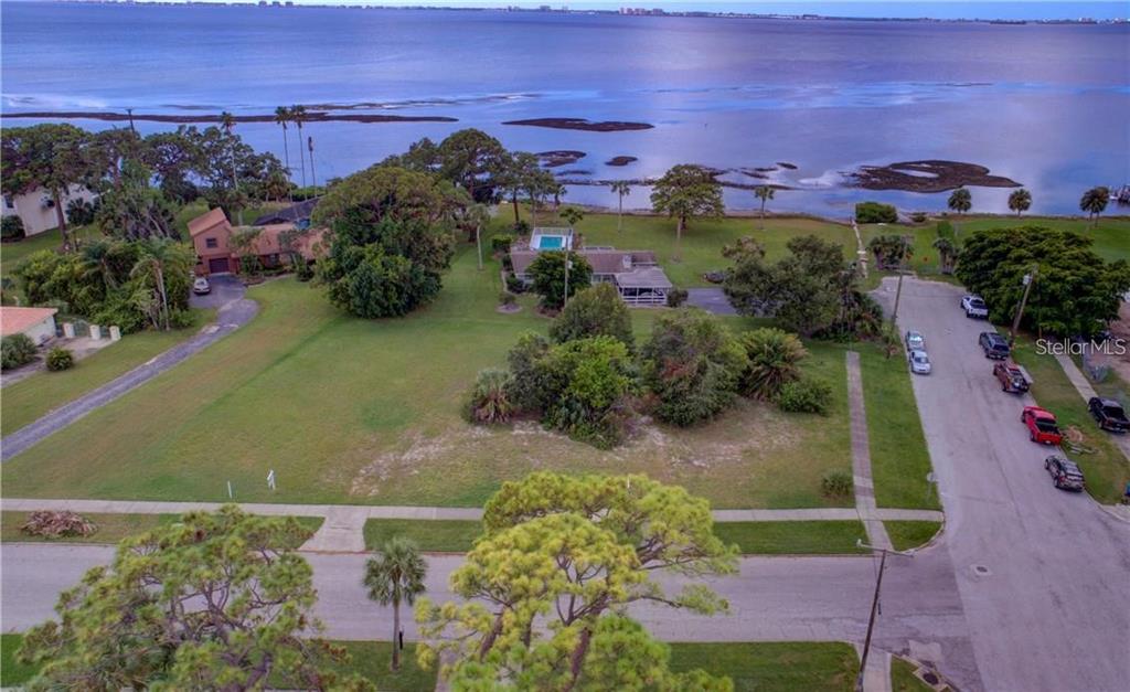 This buildable lot in the Whitfield Overlay District is now available for purchase. Located at the corner of Whitfield Avenue and Westmoreland Drive this oversized 1/3 acre building lot sits just a couple of feet from Sarasota Bay. Unobstructed bay views are visible at ground level and if you decide to build a two-story home, you'll enjoy water views all the way out to Longboat Key and beyond. Situated amongst multi-million-dollar new construction homes you can be assured an excellent view from your new dream home. Public access to the Bay to launch kayaks or swim is right at your doorstep. With 135 feet of frontage on Westmoreland Drive and 108 feet of depth, the setback requirements of the district allow for a generous floor plan and private pool. And, because this is a corner lot with frontage on Whitfield Avenue as well, you can take comfort that regardless of what gets built-up around you in the years ahead, your Sarasota Bay views will be preserved. Picture shows trees in right hand corner which are on the property. These can be removed to enhance your view.
Non engineered plans available with renderings for home shown in pictures. The home is around 4000 sq/ft under heating/cooling.