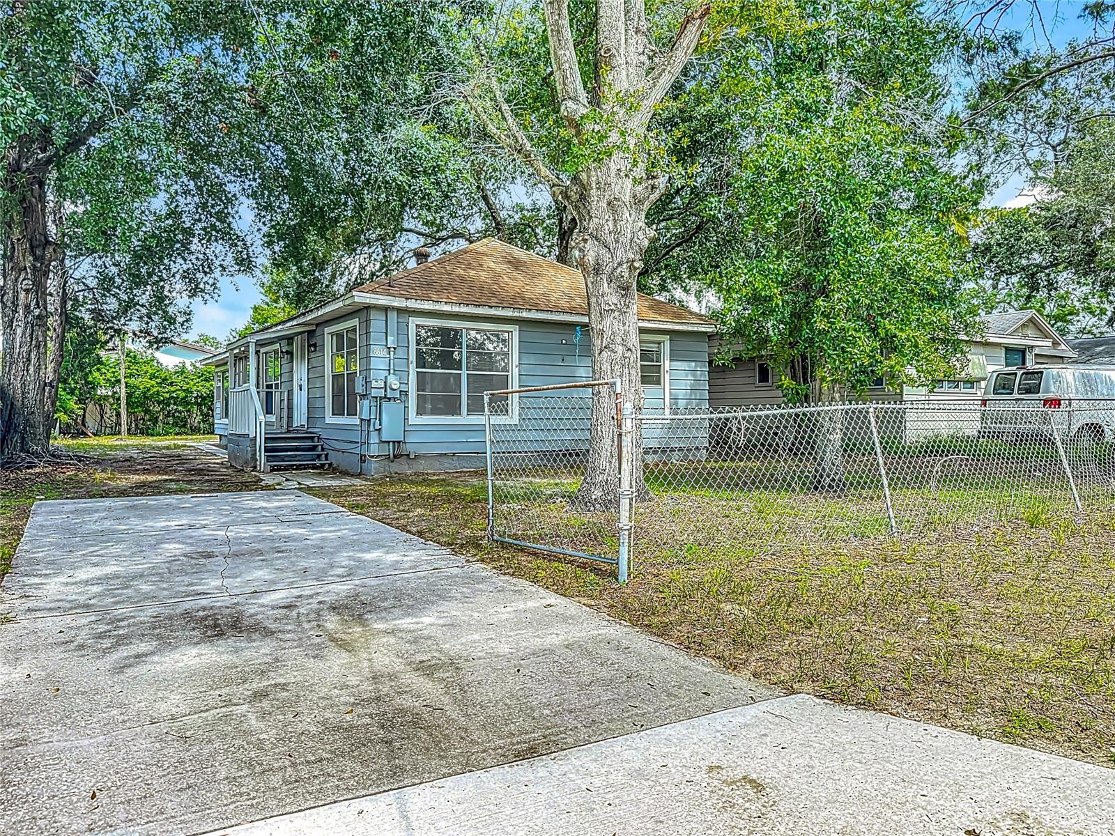 Discover this amazing home at 8614 N Orangeview Ave, Tampa, FL 33617, a beautifully updated one-story single-family residence that perfectly blends modern comfort with classic charm. This inviting 3-bedroom, 2-bathroom bungalow, spanning 1,248 square feet, boasts a bright and spacious kitchen equipped with sleek stainless steel appliances, ideal for culinary enthusiasts and entertaining guests. Both bathrooms have been thoughtfully renovated with contemporary fixtures, ensuring a fresh and stylish feel. The spacious indoor laundry room adds convenience, while the large, fully fenced backyard offers endless possibilities for outdoor activities, gardening, or simply relaxing under the shade of mature oak trees. A storage shed provides ample space for tools and equipment, and the driveway ensures hassle-free off-street parking. Nestled in a vibrant Tampa community, this home is just minutes from exciting attractions like Busch Gardens (3 miles away), where thrilling rides and wildlife adventures await, and the University of South Florida (2 miles), perfect for academic or cultural events. Enjoy local dining and drinks at The Kahwa or Gaspar's Patio Bar & Grille, both within a short drive, or explore nature at nearby Temple Crest Park (1 mile) or the Serengeti Express Train at Busch Gardens. With easy access to shopping at Publix, major roadways like I-275, and entertainment options within 20 miles, including Ybor City’s historic charm (8 miles) and the Florida Aquarium (10 miles), this move-in-ready home offers the ultimate Florida lifestyle. Don’t miss the opportunity to make this meticulously updated bungalow your own
