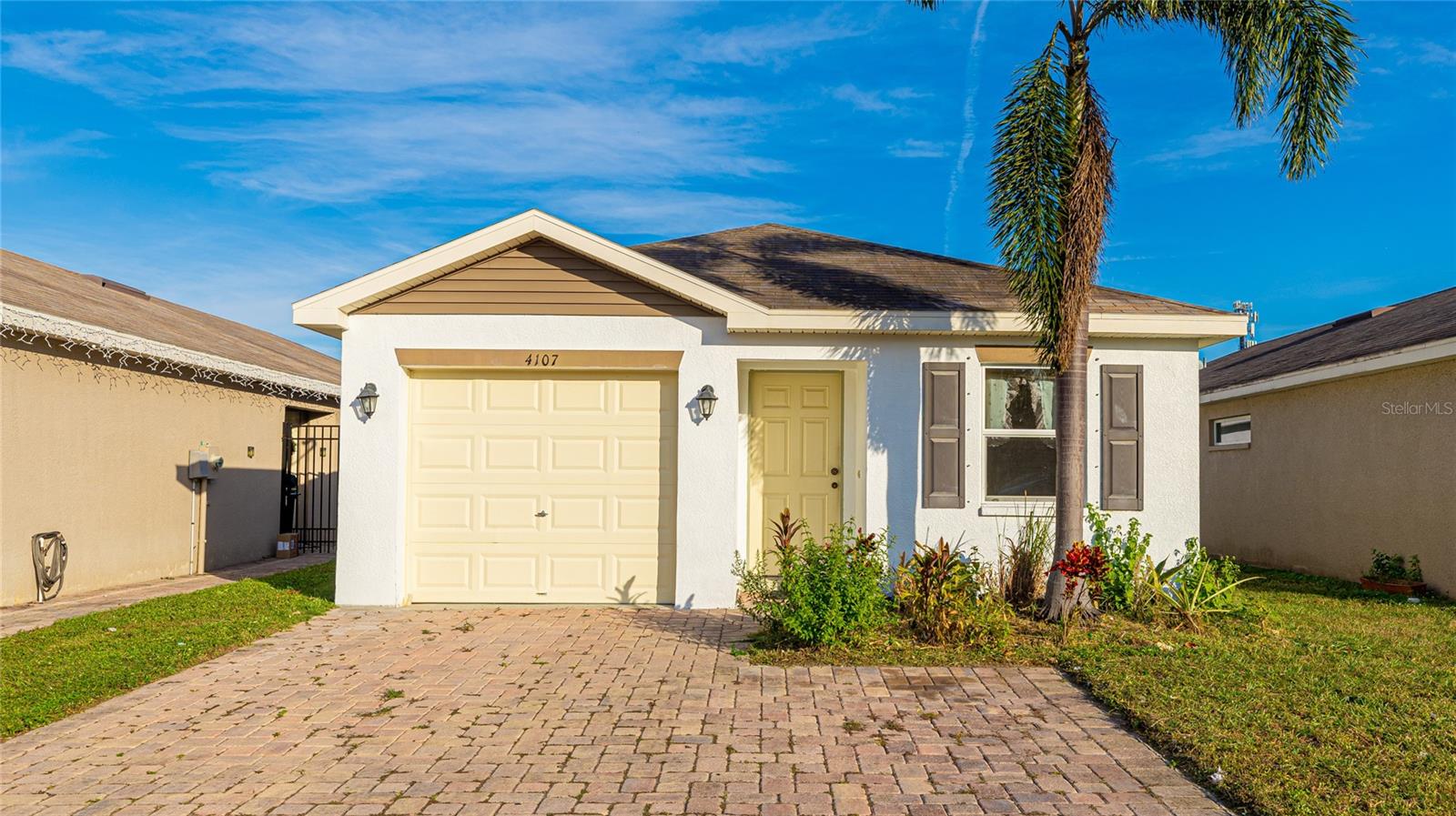 **THIS PROPERTY QUALIFIES FOR A 1% LENDER INCENTIVE IF USING PREFERRED LENDER. INQUIRE FOR MORE DETAILS.** Discover the perfect blend of comfort and practicality with this inviting 3-bedroom, 2-bathroom home in Cortez Landings. Known for its charming brick paver driveways and prime location, this neighborhood offers the perfect backdrop for your next chapter. Step inside to a thoughtfully designed open floor plan that makes daily living and entertaining a breeze. The kitchen, complete with a breakfast bar and pantry, overlooks the dining and living areas, creating a seamless flow for family gatherings or quiet evenings at home. High ceilings enhance the welcoming atmosphere, making the space feel open and airy. The primary suite, tucked off the living room, provides a private retreat, while the two additional bedrooms and hall bath are located toward the back of the home, ensuring privacy and versatility. The attached 1-car garage adds valuable storage and functionality. Ideally situated near the improved 44th Avenue Connector, this home places schools, shopping, dining, and entertainment just minutes away, offering unparalleled convenience for your everyday needs.