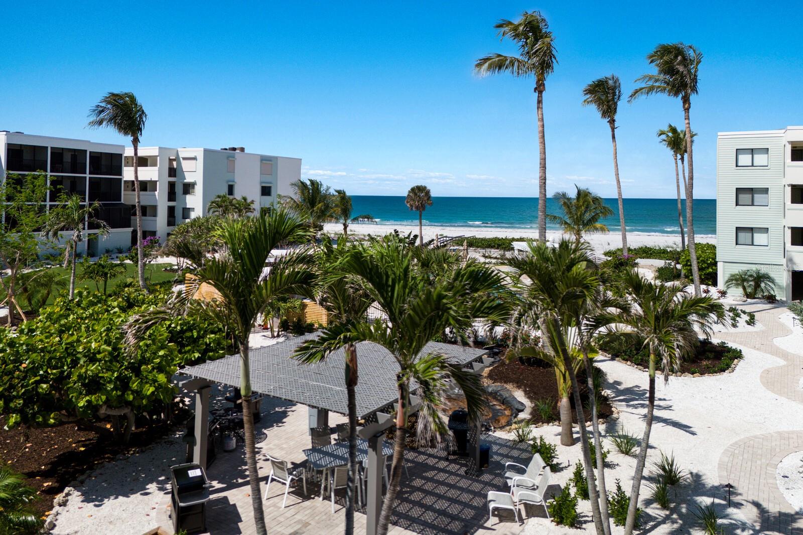 Step into a world of coastal elegance and comfort on Boca Grande’s most coveted stretch of beach. This beautifully appointed 2-bedroom, 
2-bath corner condominium is nestled within a pristine, gated community—offering both privacy and a sense of belonging.
From the moment you enter, you’ll be captivated by the serene views through lush tropical courtyards out to the Gulf, setting a tranquil backdrop for daily living. As a corner residence, the home is bathed in natural sunlight, with extra windows brightening the kitchen and master suite—creating an airy, uplifting atmosphere.
The expansive floor plan flows effortlessly, featuring spacious living areas that invite you to unwind or entertain in style. Enjoy your morning coffee or evening gatherings at the charming breakfast bar, which seamlessly connects the dining area to the heart of the home.
One of the property’s most enchanting features is its double screened lanai design—offering two generous outdoor living spaces. Here, you can savor gentle Gulf breezes, bask in quiet mornings, or host friends against a backdrop of swaying palms and tranquil sea air.
Practicality meets luxury with first-floor access above secure under-building parking and a private storage closet—perfect for your beach gear or personal treasures. The building’s crisp white exterior, accented by bluish-green HardiePlank siding, highlights its timeless coastal appeal.
Step outside to discover a resort-style courtyard: unwind by the heated swimming pool and spa, soak up the sun on the expanded deck, or enjoy al fresco dining in one of two BBQ areas. For the active at heart, upgraded tennis courts and convenient elevators add to your ease and enjoyment. Dedicated on-site management ensures peace of mind and a seamless living experience.
Just moments away, explore world-class fishing, golf, boutique shopping, and Boca Grande’s celebrated dining—all at your fingertips.
Experience the lifestyle you deserve in this exceptional Gulf-front retreat—where every day feels like a getaway. Schedule your private tour today and discover the warmth, beauty, and exclusivity that await you!