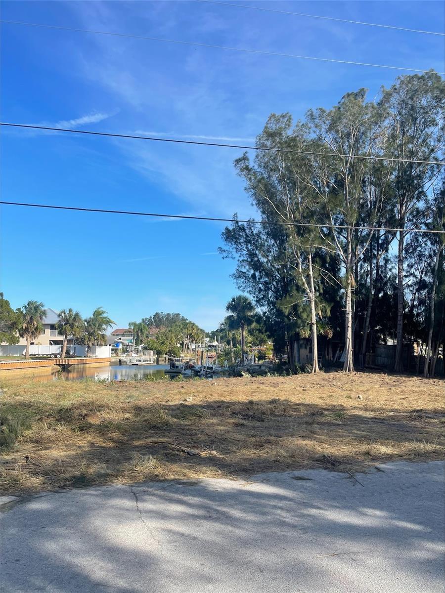 Build your dream getaway home on this waterfront lot with canal access to the Gulf of Mexico. This property allows you to build a dock on the canal for easy water access. Property buildable with easements grandfathered into the lot which allows for a residential home. Amazing opportunity to have an active, water lifestyle with boating, fishing, and watersports. The current owners have cleared the property of trees to provide a site that is ready for building.