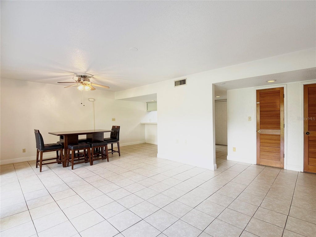 Photo of 3033 Camelot Drive #303, Haines City, FL 33844 (MLS # O6439008)