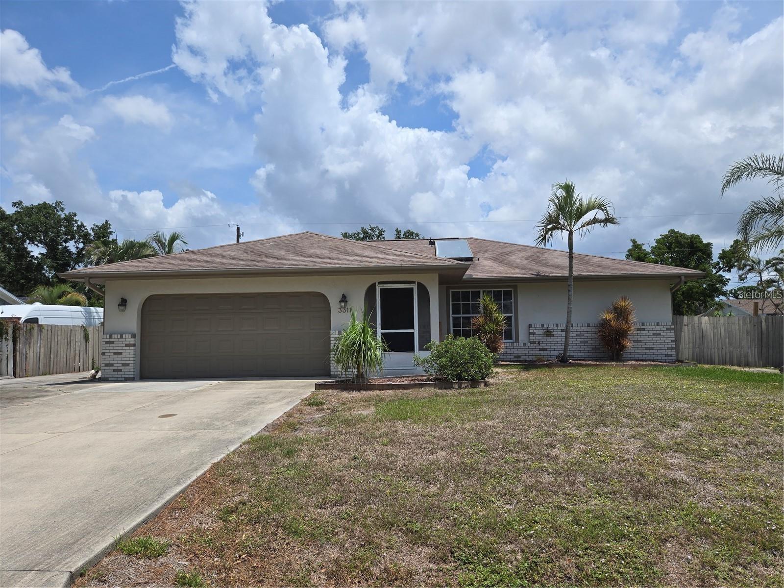 No Deed Restrictions! No HOA! No CDD! Not in a Flood Zone! Welcome to this well-maintained 2-bedroom, 2-bath single-family home offering comfort, flexibility, and room to grow—without the burden of community fees or restrictions. Nestled in a non-flood zone area, this home is ideal for those seeking freedom and functionality. Step inside to a spacious and thoughtfully laid-out interior. The kitchen features beautiful wood cabinets, granite countertops, and abundant cabinet space, perfect for the home chef or anyone who loves to entertain. The primary bedroom boasts a large walk-in closet, while the second bedroom is perfect for guests or family. A bonus room with its own closet provides versatile space for an office, den, or even a third bedroom. You'll also love the oversized 2-car garage, complete with a workbench—great for storage, hobbies, or projects. Outside, there's a large parking pad, ideal for boat, camper, or RV parking, something you rarely find in homes without restrictions. With solid features, no flood insurance required, and space to truly make your own, this home offers unbeatable value and peace of mind.
