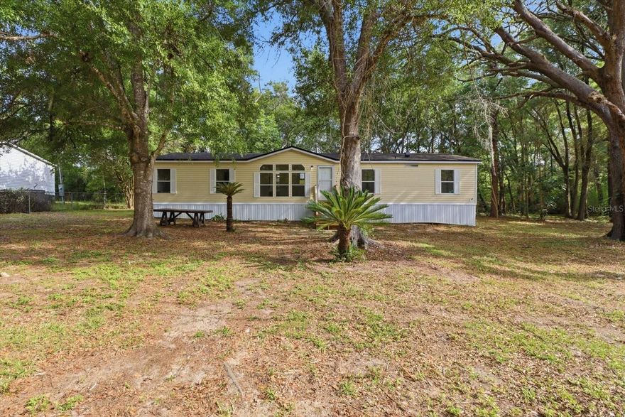 Completely updated and move-in ready, this beautifully refreshed 4-bedroom, 2-bath manufactured home is perfectly situated on a private 0.51-acre wooded lot in the heart of Inverness, FL. Updates also include a brand new roof! Filled with natural light, the home features an inviting open floor plan designed for comfortable everyday living and easy entertaining.

The spacious living room showcases a large picture window that brings the outdoors in, while durable LVP flooring flows seamlessly throughout the main living areas. The kitchen and living spaces connect effortlessly, creating a bright and functional layout. All bedrooms are generously sized, offering flexibility for guests, office space, or family needs.

The primary suite is a true retreat, featuring a fully updated ensuite bath with dual sinks, a soaking tub, and a separate walk-in shower. Secondary bedrooms are well-appointed and share a beautifully updated full bath.

Enjoy outdoor living with a back patio overlooking the peaceful, tree-lined yard—perfect for relaxing, grilling, or enjoying Florida evenings in privacy.

Located in a quiet Inverness neighborhood, this home offers a serene setting while still being just minutes from downtown Inverness, local shopping, restaurants, lakes, parks, and the Withlacoochee State Trail. Experience the best of Citrus County living with space, updates, and convenience all in one.