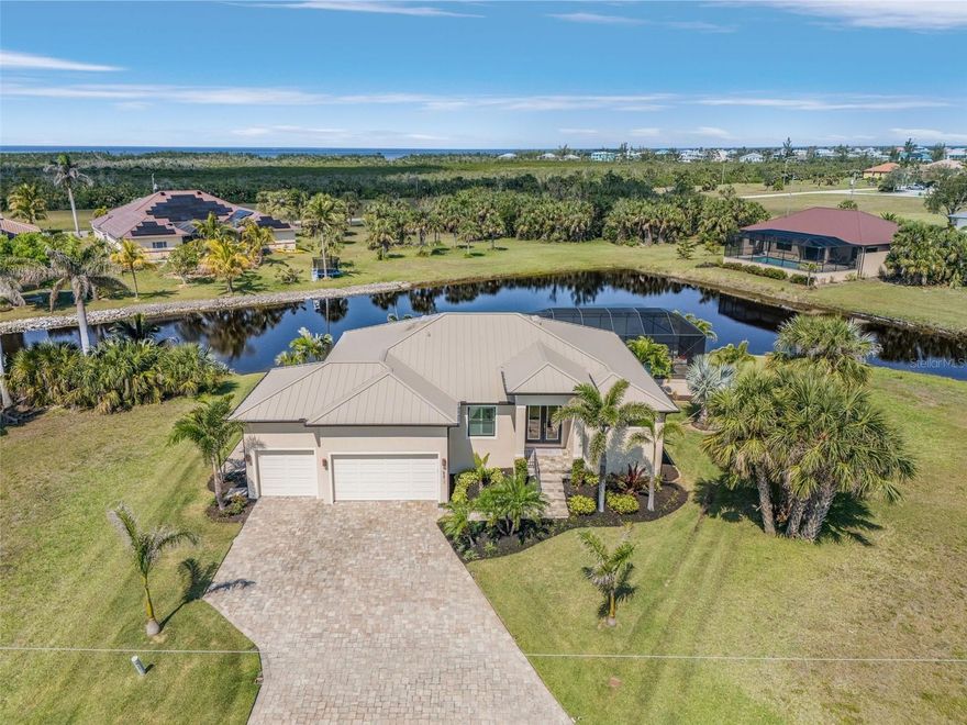Beautiful  Lakeside View with huge lanai and pool: Your Burnt Store Lakes Oasis Awaits! Imagine waking to the gentle shimmer of sunlight dancing across a fish-filled lake, right in your own backyard. This spacious, open-concept home in the serene community of Burnt Store Lakes offers a lifestyle of relaxed luxury and effortless entertaining. Step inside and be greeted by a light-filled living space, where the gourmet kitchen seamlessly blends with the living area. Granite countertops, a generous island, and high-end stainless-steel appliances create a culinary haven perfect for hosting gatherings. Modern fixtures and luxury finishes throughout elevate the experience, ensuring every moment feels special. Retreat to the primary suite, a true sanctuary designed for relaxation. Two expansive walk-in closets provide ample storage, while the in suite bathroom boasts a spa-like soaking tub, a split vanity with a dedicated makeup area, a walk-in shower, and a private water closet with an impact window for added peace of mind. Sliding doors open to your private outdoor haven, inviting in refreshing breezes and abundant natural light. The current owners have transformed the outdoor space into an entertainer’s paradise. A sprawling 721 sq. ft. lanai, anchored by a sparkling 288 sq. ft. pool, extends from the original 225 sq. ft. porch, creating an expansive outdoor living area perfect for enjoying Florida’s sunshine and balmy evenings. For the hobbyist or those needing extra storage, this home delivers. An extra large 683 sq ft real three-car garage provides ample space for three vehicles and features room for a dedicated workshop. Imagine the possibilities! Living in Burnt Store Lakes means embracing a tranquil lifestyle surrounded by nature. Enjoy easy access to the Burnt Store Isles boat ramp, leading to the pristine waters of Charlotte Harbor and the Gulf of Mexico. Explore nearby golf courses, indulge in waterfront dining, and discover the friendly, welcoming atmosphere that makes this community so special. Deed restrictions ensure the neighborhood maintains its pristine appearance, and lower HOA fees compared to other communities provide exceptional value. This isn't just a house; it's a lifestyle. Don't miss your opportunity to own a piece of paradise in Burnt Store Lakes."