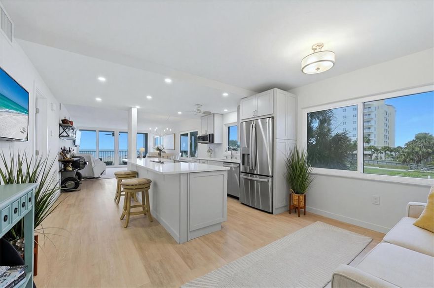 It's all about the view...
This turnkey, north-facing end unit residence, fully remodeled in 2026, captures unobstructed Gulf-front views spanning 180 degrees, from the jetty along the coastline to open water horizons. Set along the iconic shores of Venice, Florida, each evening brings a new version of sunset. Residence 205 at 555 The Esplanade presents a rare opportunity to step into a just completed coastal home where nothing has been left untouched. The thoughtfully rebuilt interior reflects a refined coastal palette and a sense of ease that defines waterfront living. From the moment you enter, your eye is drawn straight to the water. The openness of the space, combined with a clear line of sight to the Gulf, just feels like home. A flexible area near the entry offers space for guests, a home office, or a quiet sitting area. The main living space is designed to gather people together, with the kitchen fully open to the living and dining areas. High-end appliances, soft-close cabinetry, and quartz countertops create a space that is both functional and beautifully integrated. Furniture carefully curated to flow with the luxury coastal finishes, this home is comfortable and luxurious. With impact rated windows all around, natural light moves throughout the residence from morning through evening. The result is a home that feels bright, calm and connected to its surroundings. The primary bedroom offers a quiet retreat with floor to ceiling water views and a fully updated en-suite bath. The second bedroom, spacious enough for the 2 queen beds enjoys a pristine bath providing comfort and privacy for guests. Enjoy the enclosed lanai at daybreak or sunset where the gulf calls you to relax and simply be.  In this home, the work has already been done. The renovation is complete, the design is in place, and the setting is established, allowing for immediate enjoyment without the time or uncertainty of construction. Just bring your suitcase, suit, and flip flops and start living the Island Life today!